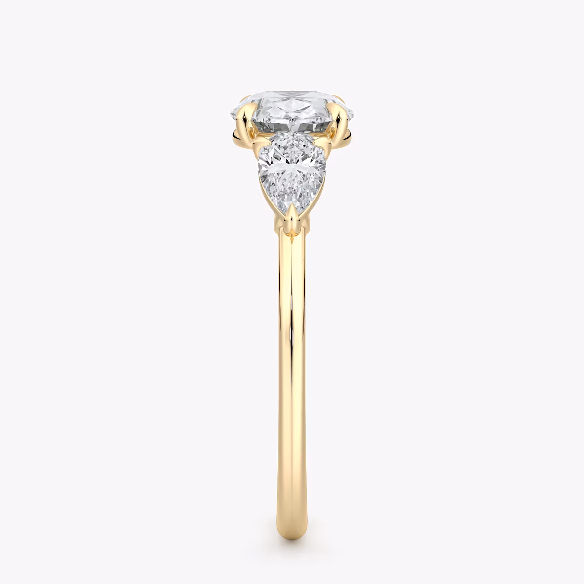 The Three Stone | Oval | 18k | Yellow Gold | bandAccent: Plain | diamondOrientation: horizontal | sideStoneCarat: 0.25ct | sideStoneShape: Pear | caratWeight: other
