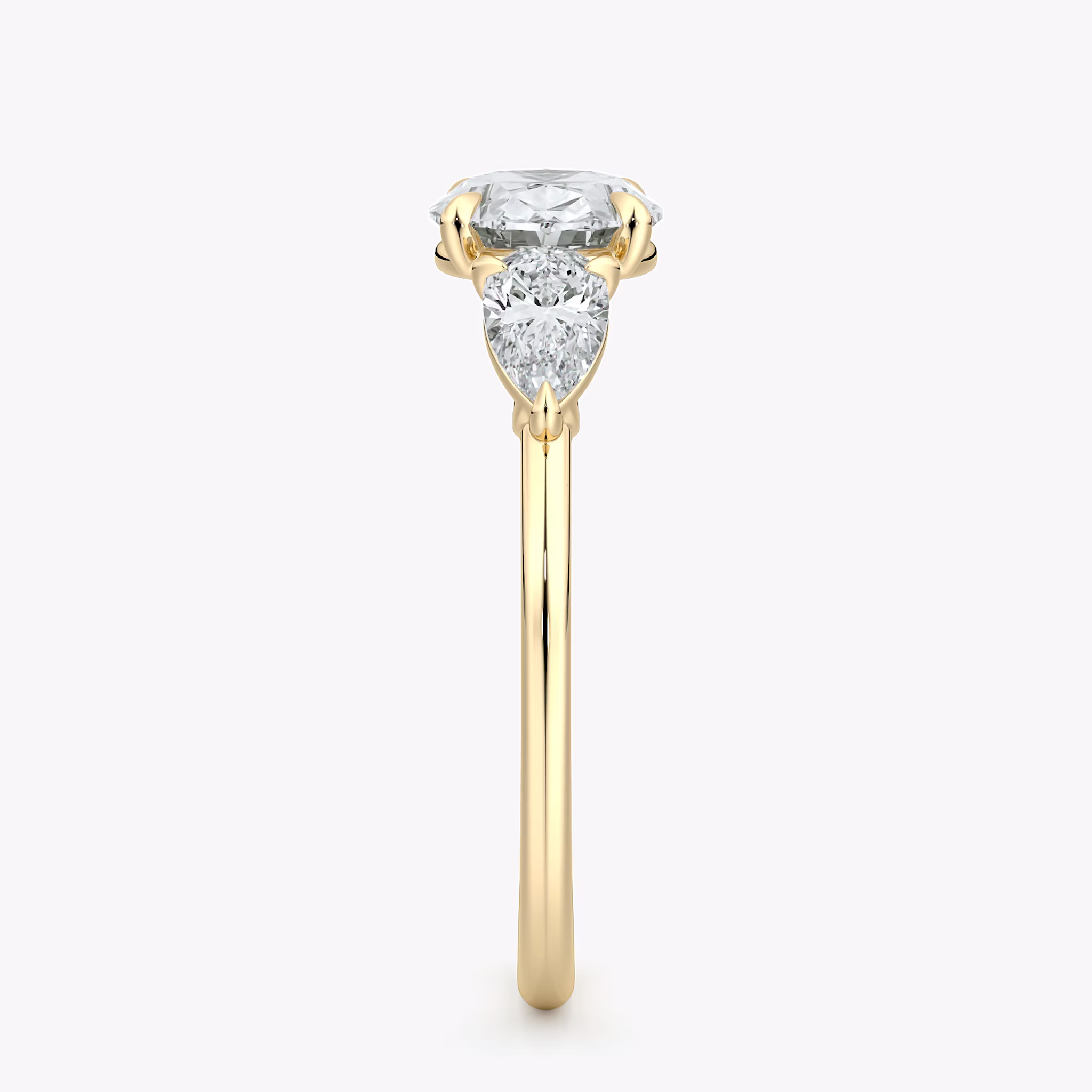 The Three Stone | Oval | 18k | Yellow Gold | bandAccent: Plain | diamondOrientation: horizontal | sideStoneCarat: 0.25ct | sideStoneShape: Pear | caratWeight: other