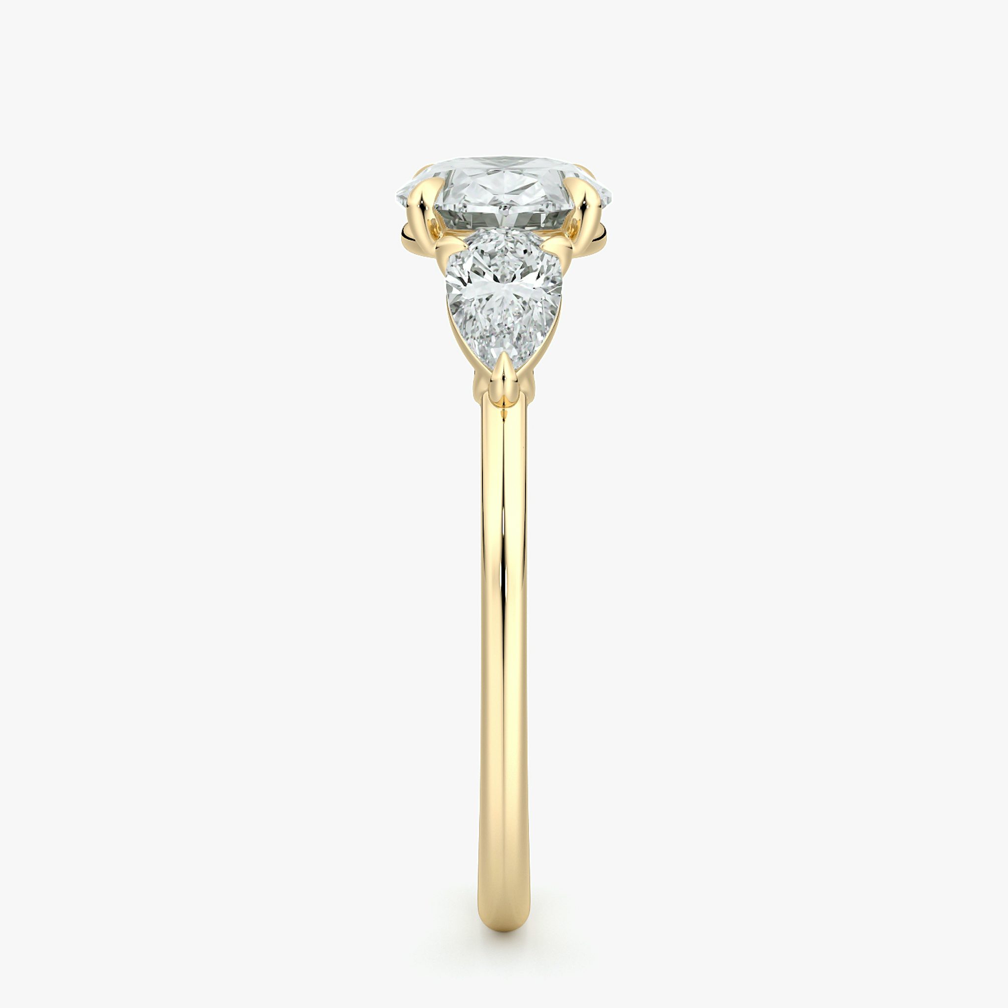 The Three Stone | Oval | 18k | Yellow Gold | bandAccent: Plain | diamondOrientation: horizontal | sideStoneCarat: 0.25ct | sideStoneShape: Pear | caratWeight: other