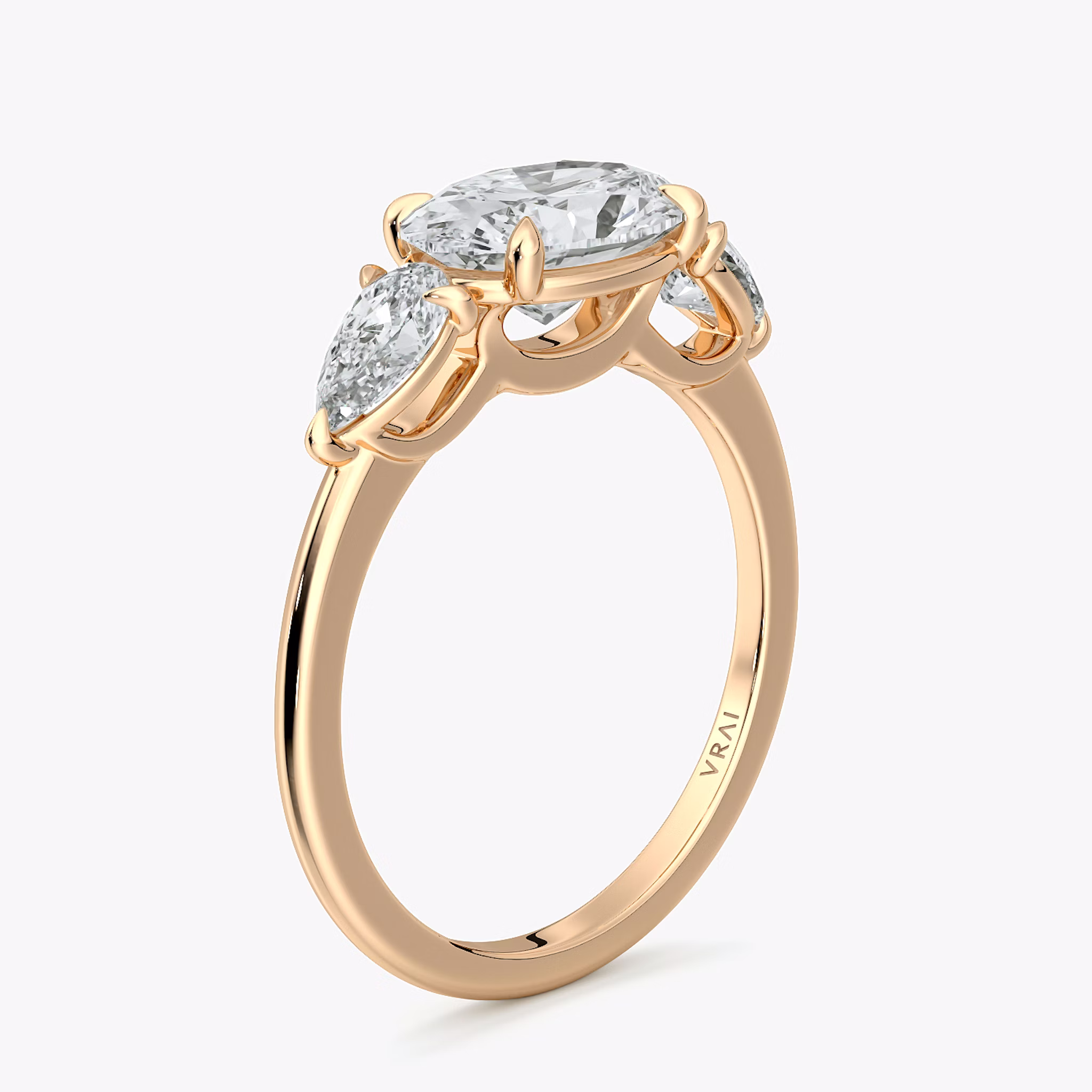 The Three Stone | Oval | 14k | Rose Gold | bandAccent: Plain | diamondOrientation: horizontal | sideStoneCarat: 0.25ct | sideStoneShape: Pear | caratWeight: other