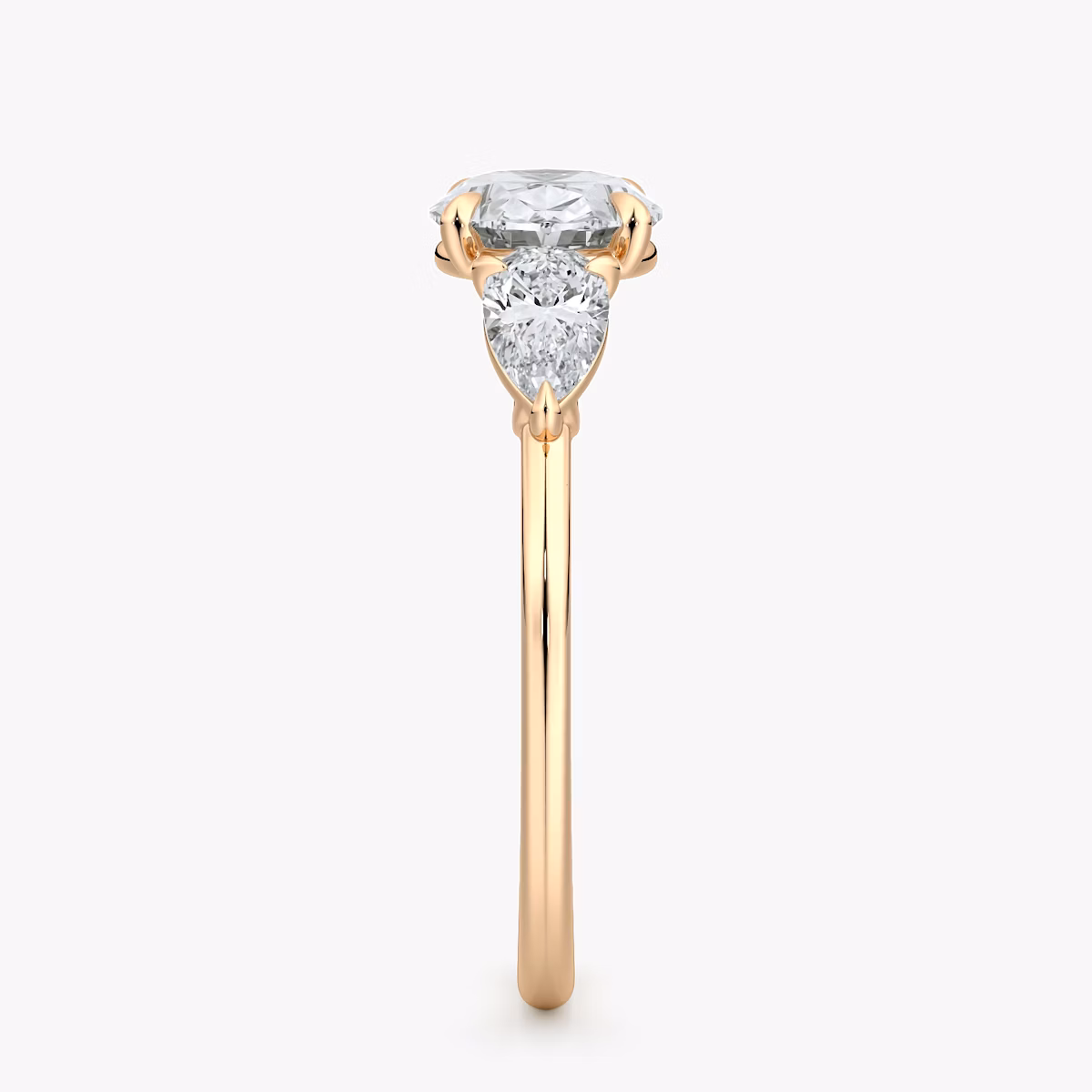 The Three Stone | Oval | 14k | Rose Gold | bandAccent: Plain | diamondOrientation: horizontal | sideStoneCarat: 0.25ct | sideStoneShape: Pear | caratWeight: other