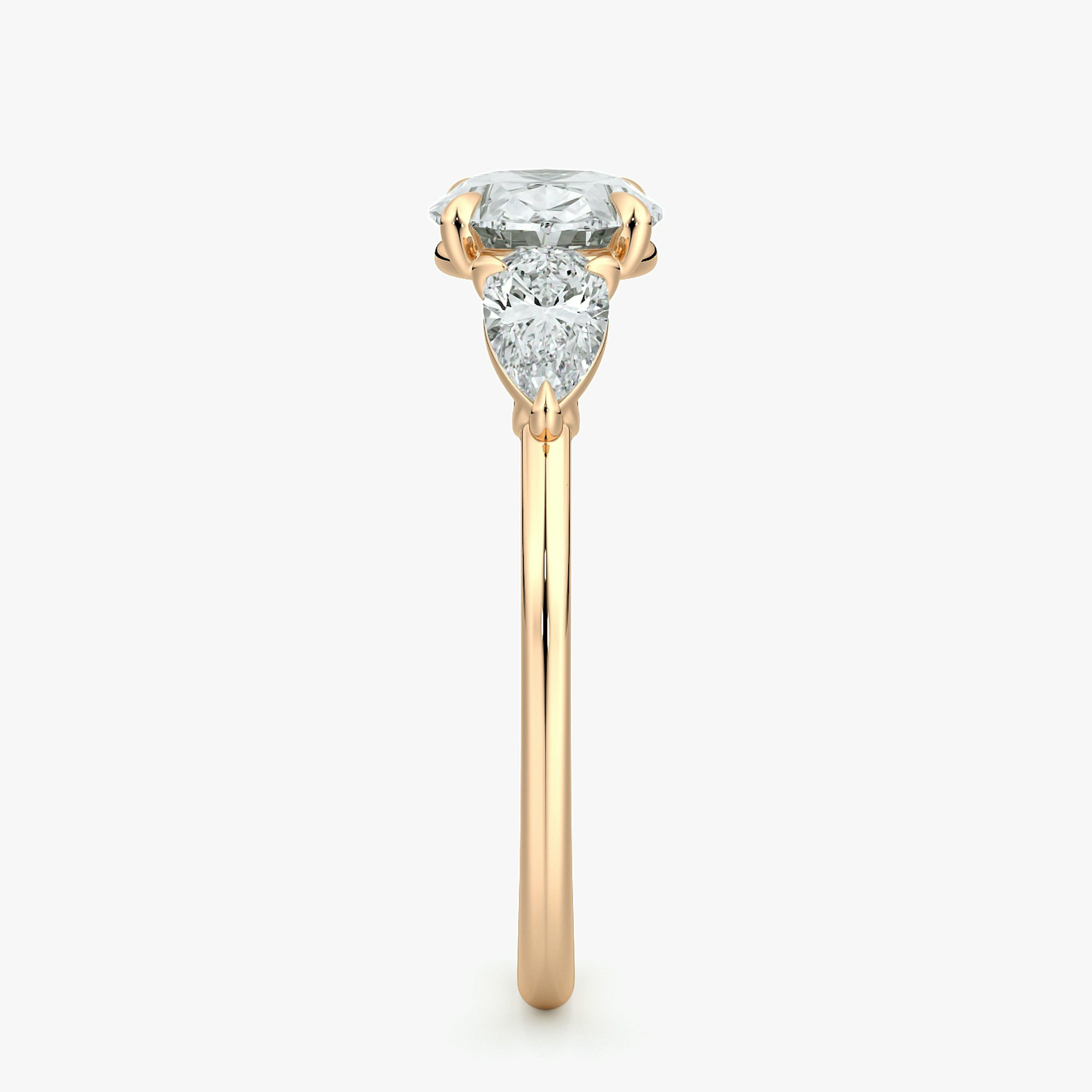 The Three Stone | Oval | 14k | Rose Gold | bandAccent: Plain | diamondOrientation: horizontal | sideStoneCarat: 0.25ct | sideStoneShape: Pear | caratWeight: other