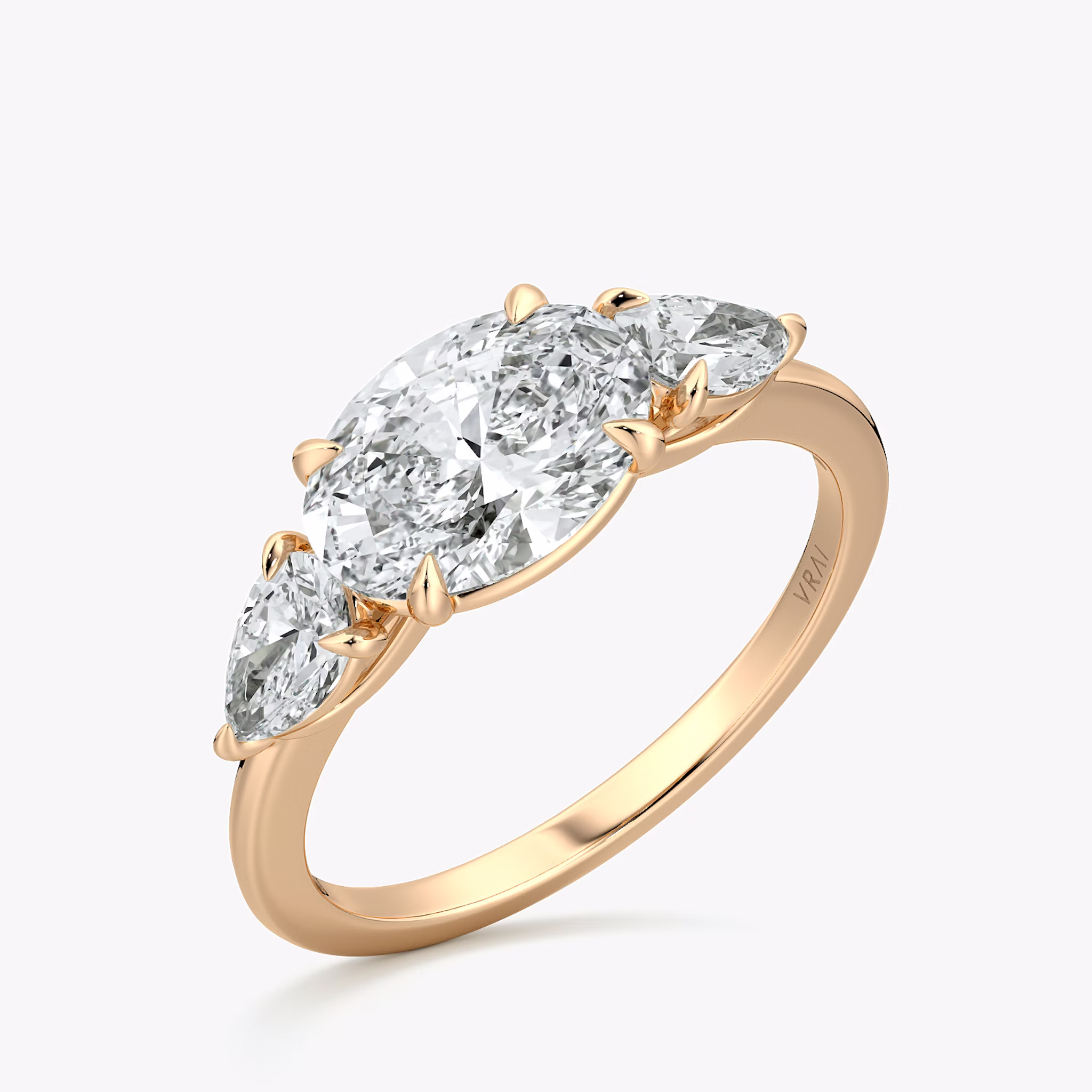 The Three Stone | Oval | 14k | Rose Gold | bandAccent: Plain | diamondOrientation: horizontal | sideStoneCarat: 0.25ct | sideStoneShape: Pear | caratWeight: other