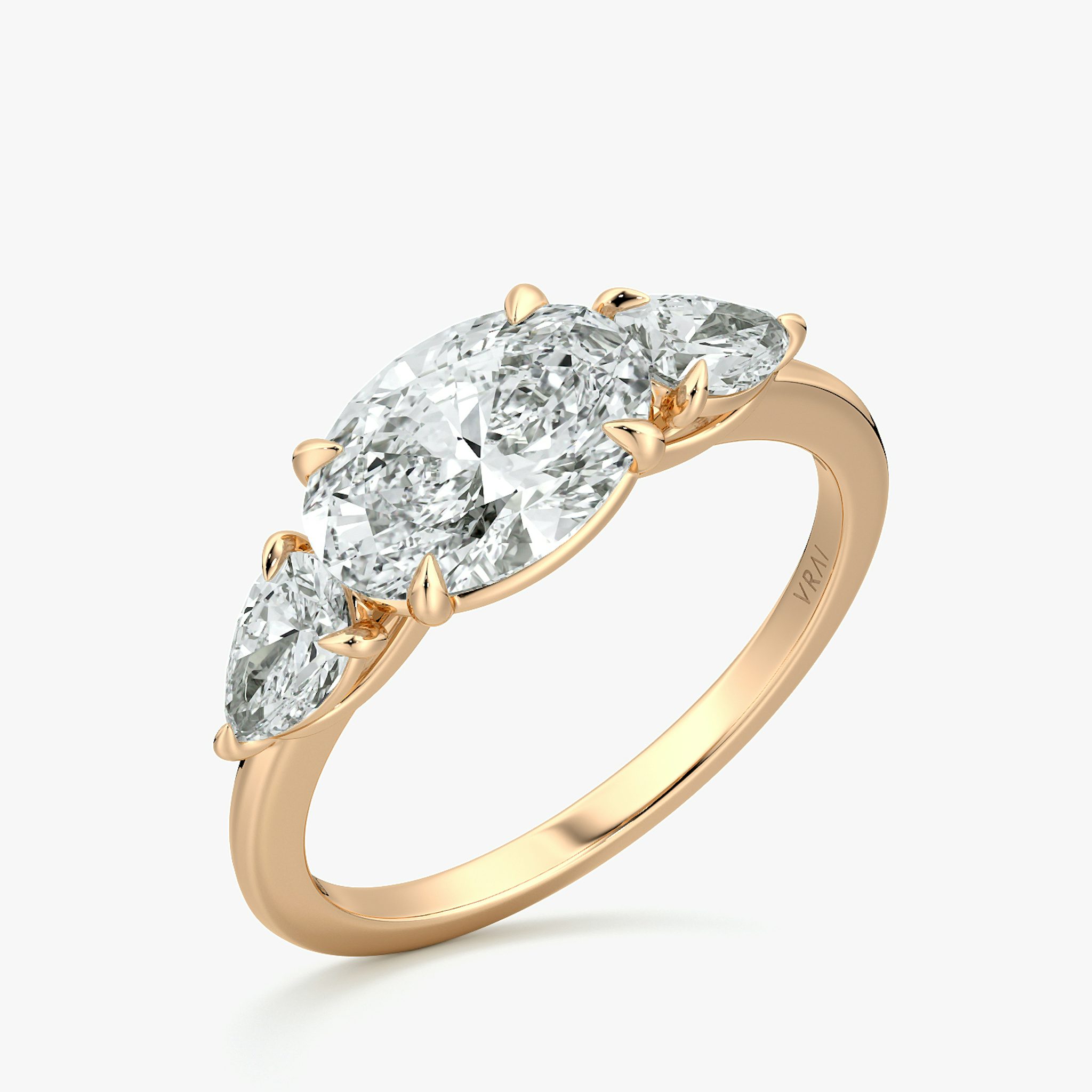 The Three Stone | Oval | 14k | Rose Gold | bandAccent: Plain | diamondOrientation: horizontal | sideStoneCarat: 0.25ct | sideStoneShape: Pear | caratWeight: other