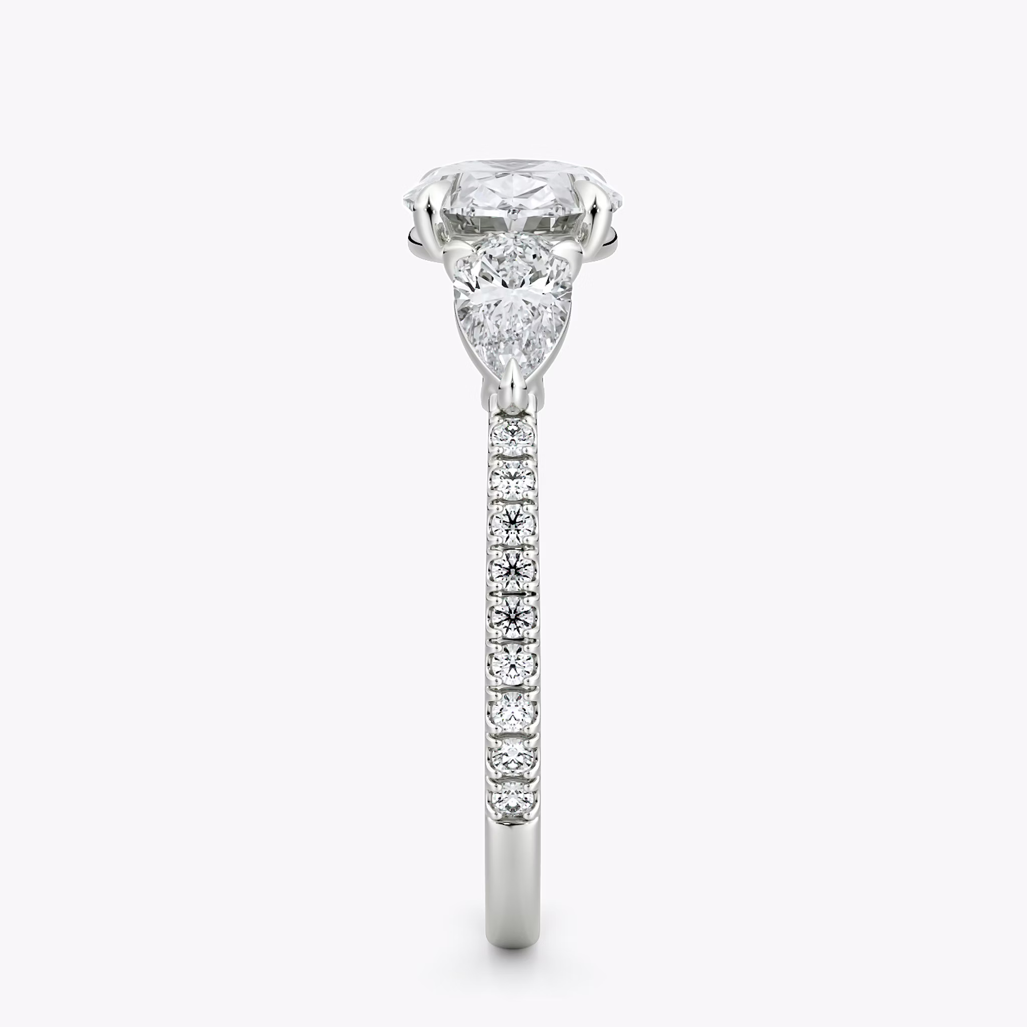 The Three Stone | Oval | 18k | White Gold | bandAccent: Pavé | diamondOrientation: horizontal | sideStoneCarat: 0.25ct | sideStoneShape: Pear | caratWeight: other