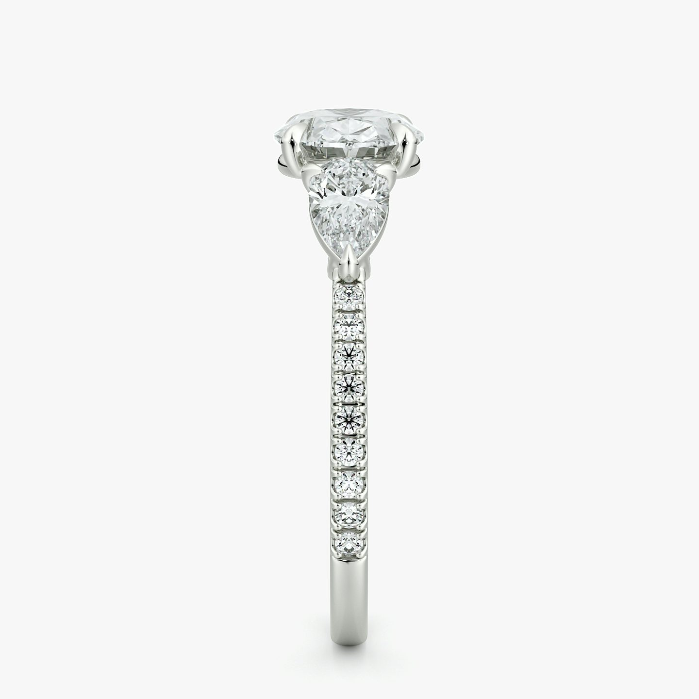 The Three Stone | Oval | Platinum | bandAccent: Pavé | diamondOrientation: horizontal | sideStoneCarat: 0.25ct | sideStoneShape: Pear | caratWeight: other
