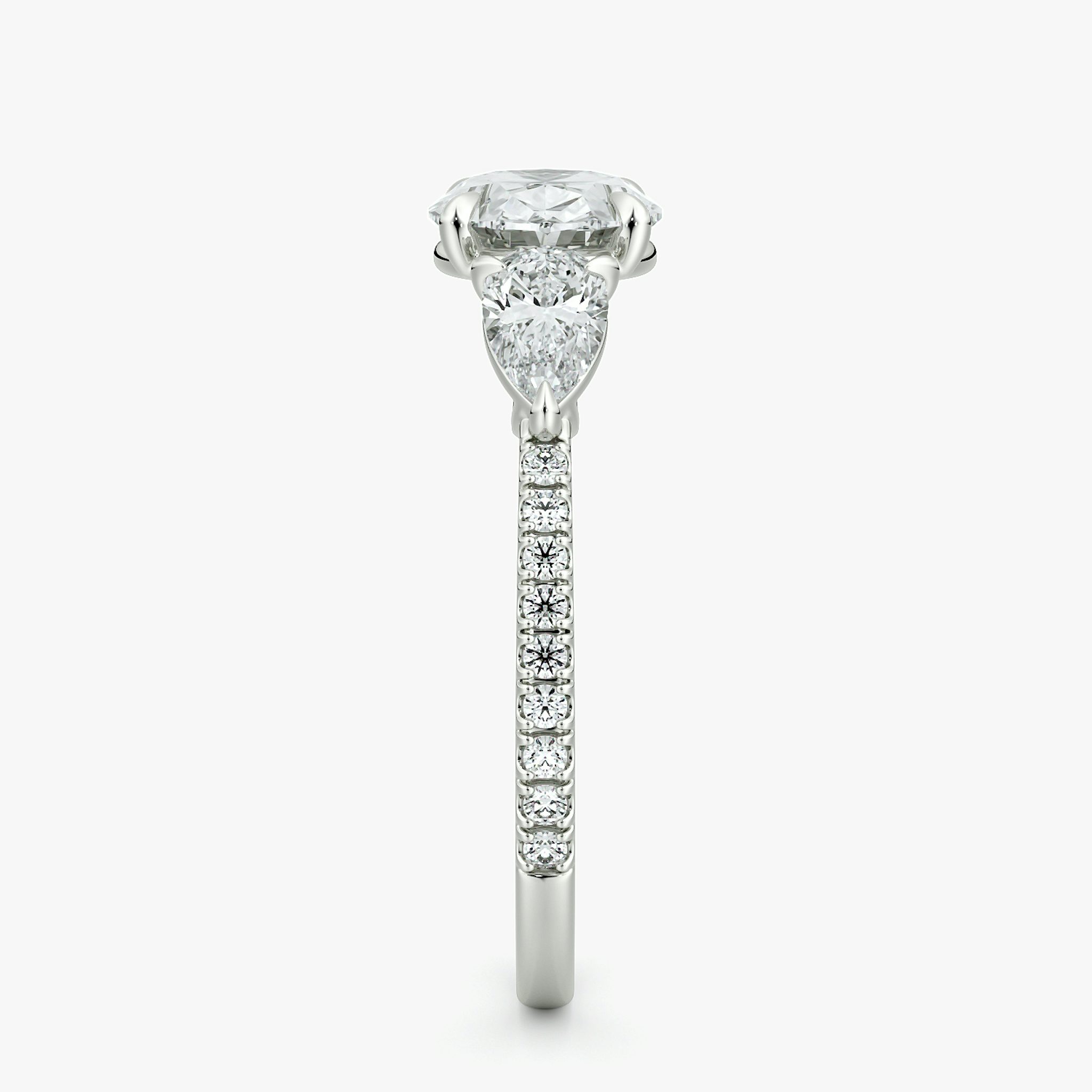 The Three Stone | Oval | 18k | White Gold | bandAccent: Pavé | diamondOrientation: horizontal | sideStoneCarat: 0.25ct | sideStoneShape: Pear | caratWeight: other