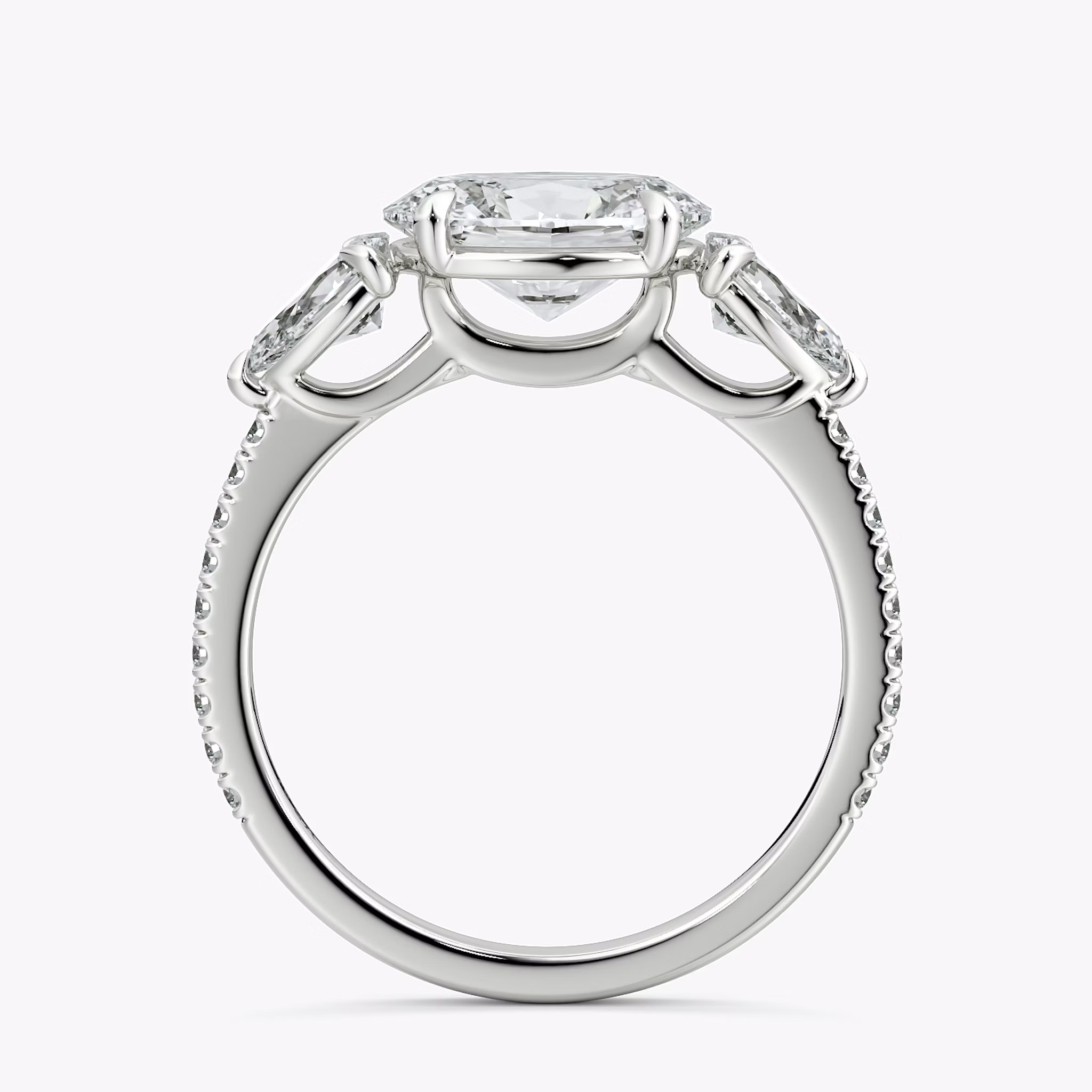 The Three Stone | Oval | 18k | White Gold | bandAccent: Pavé | diamondOrientation: horizontal | sideStoneCarat: 0.25ct | sideStoneShape: Pear | caratWeight: other
