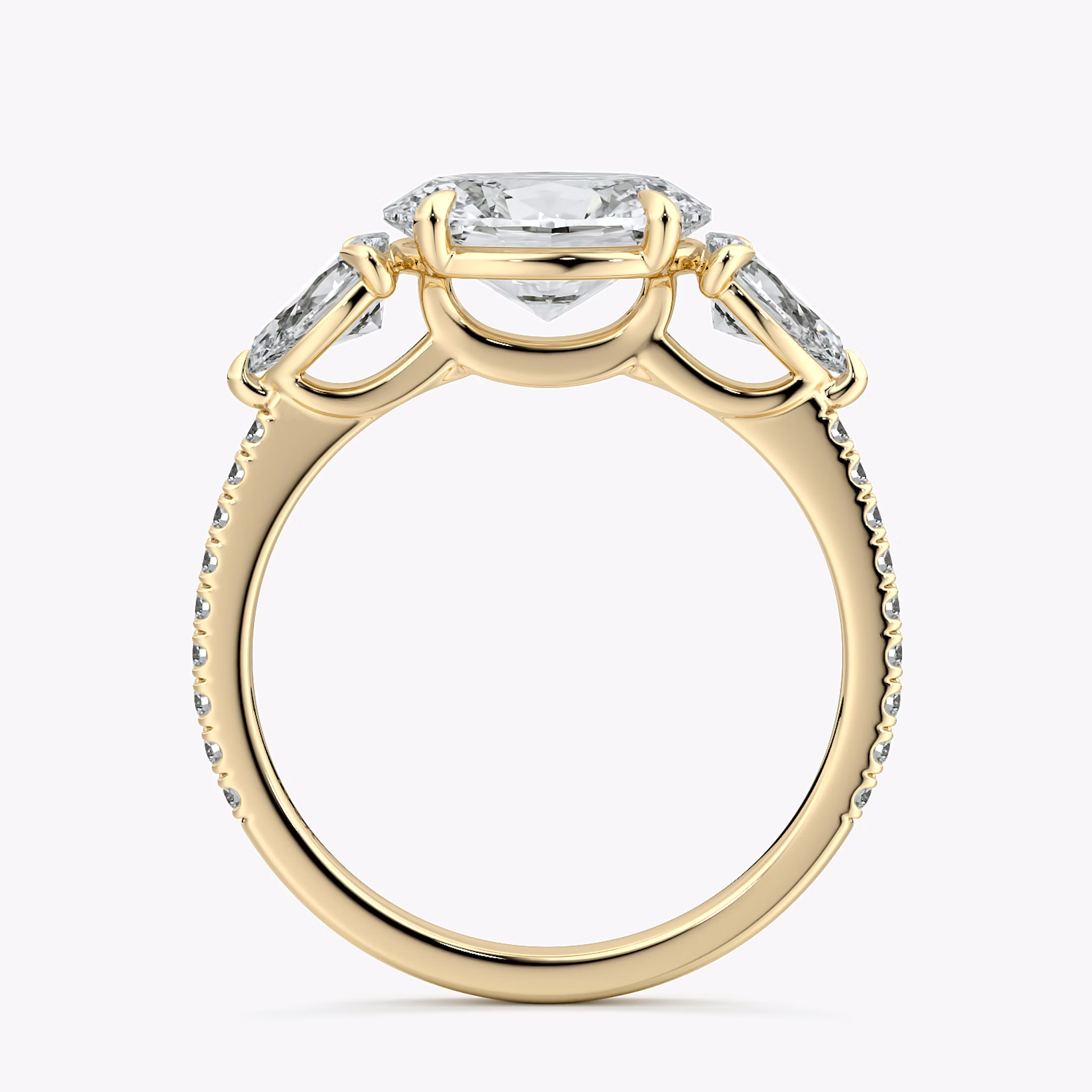 The Three Stone | Oval | 18k | Yellow Gold | bandAccent: Pavé | diamondOrientation: horizontal | sideStoneCarat: 0.25ct | sideStoneShape: Pear | caratWeight: other