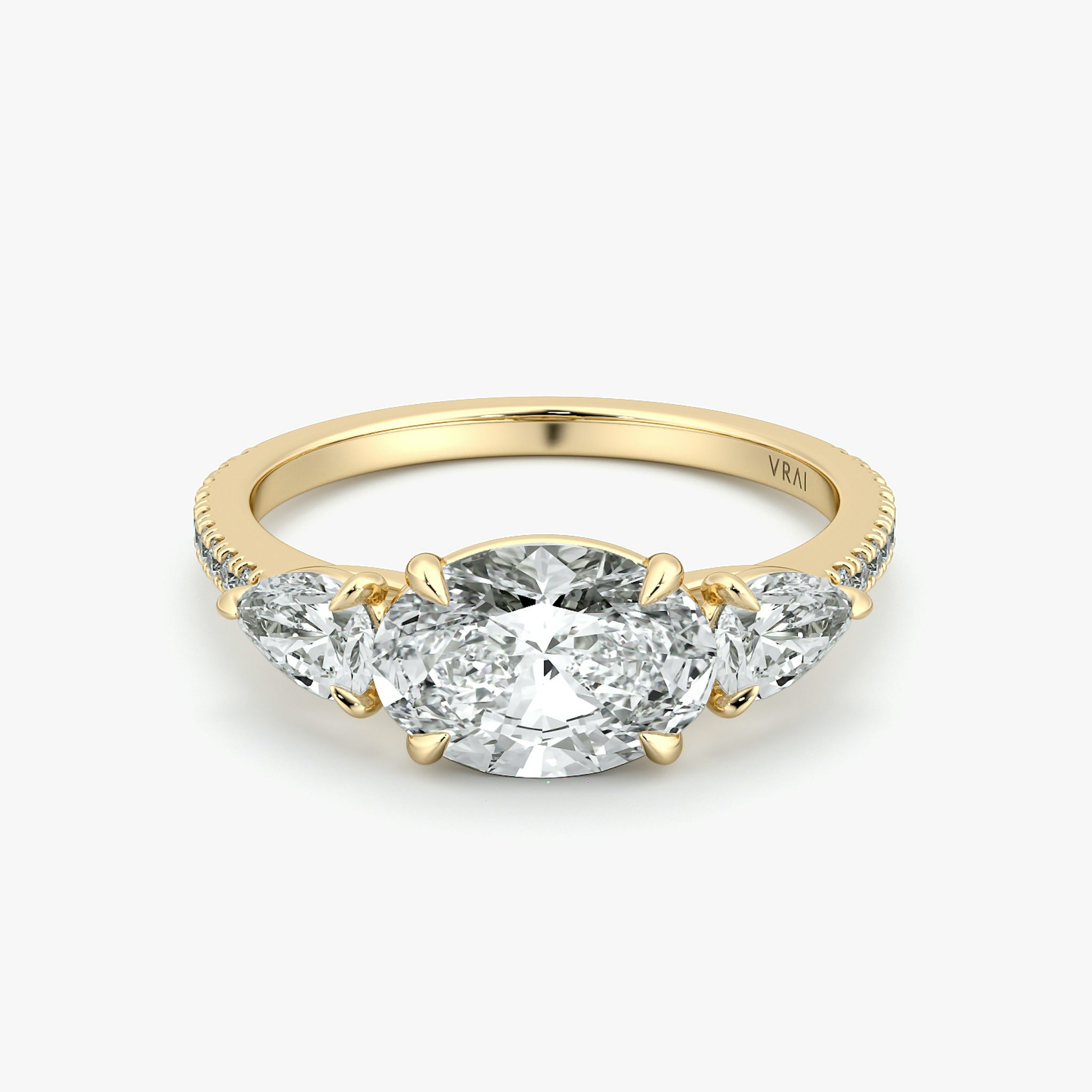 The Three Stone | Oval | 18k | Yellow Gold | bandAccent: Pavé | diamondOrientation: horizontal | sideStoneCarat: 0.25ct | sideStoneShape: Pear | caratWeight: other
