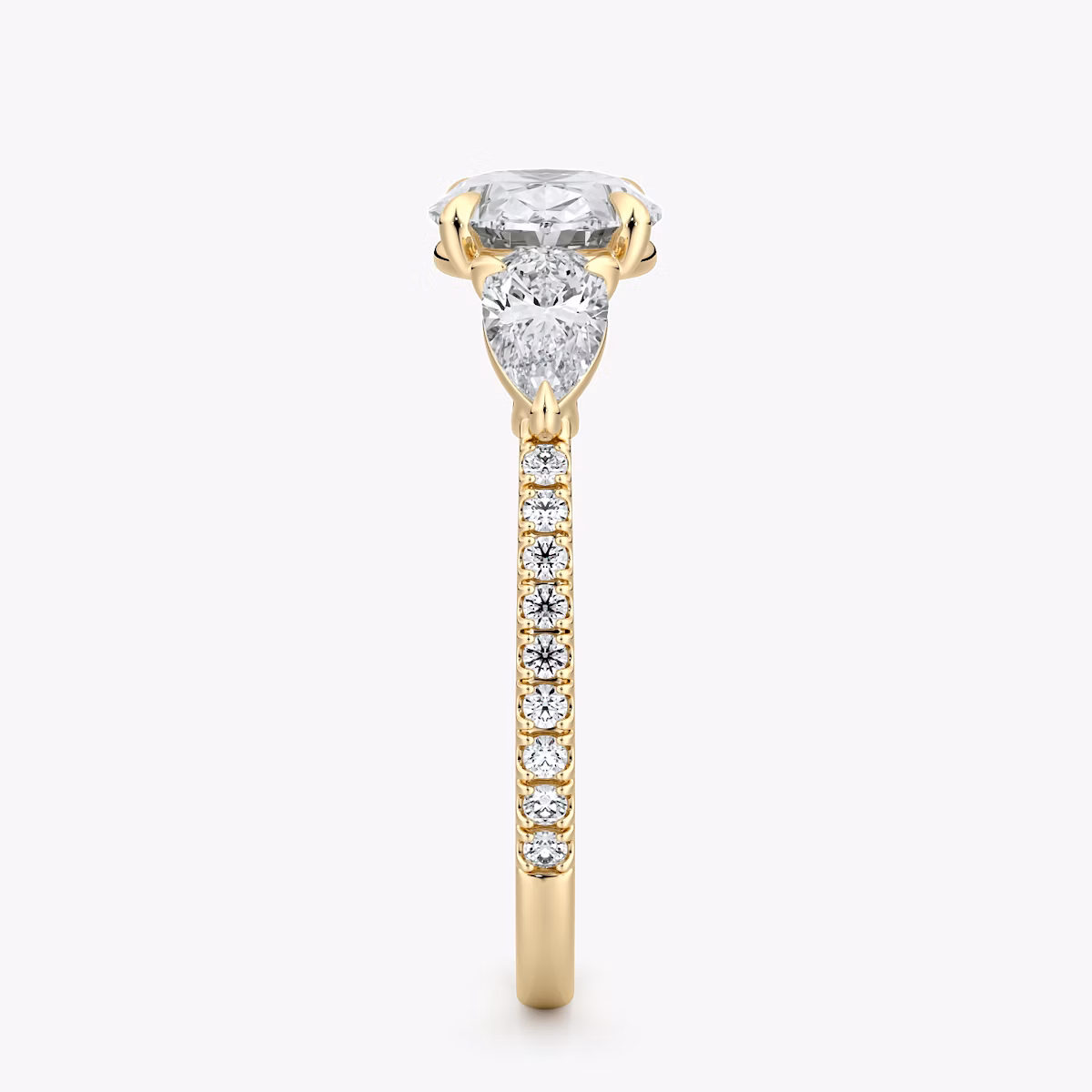 The Three Stone | Oval | 18k | Yellow Gold | bandAccent: Pavé | diamondOrientation: horizontal | sideStoneCarat: 0.25ct | sideStoneShape: Pear | caratWeight: other