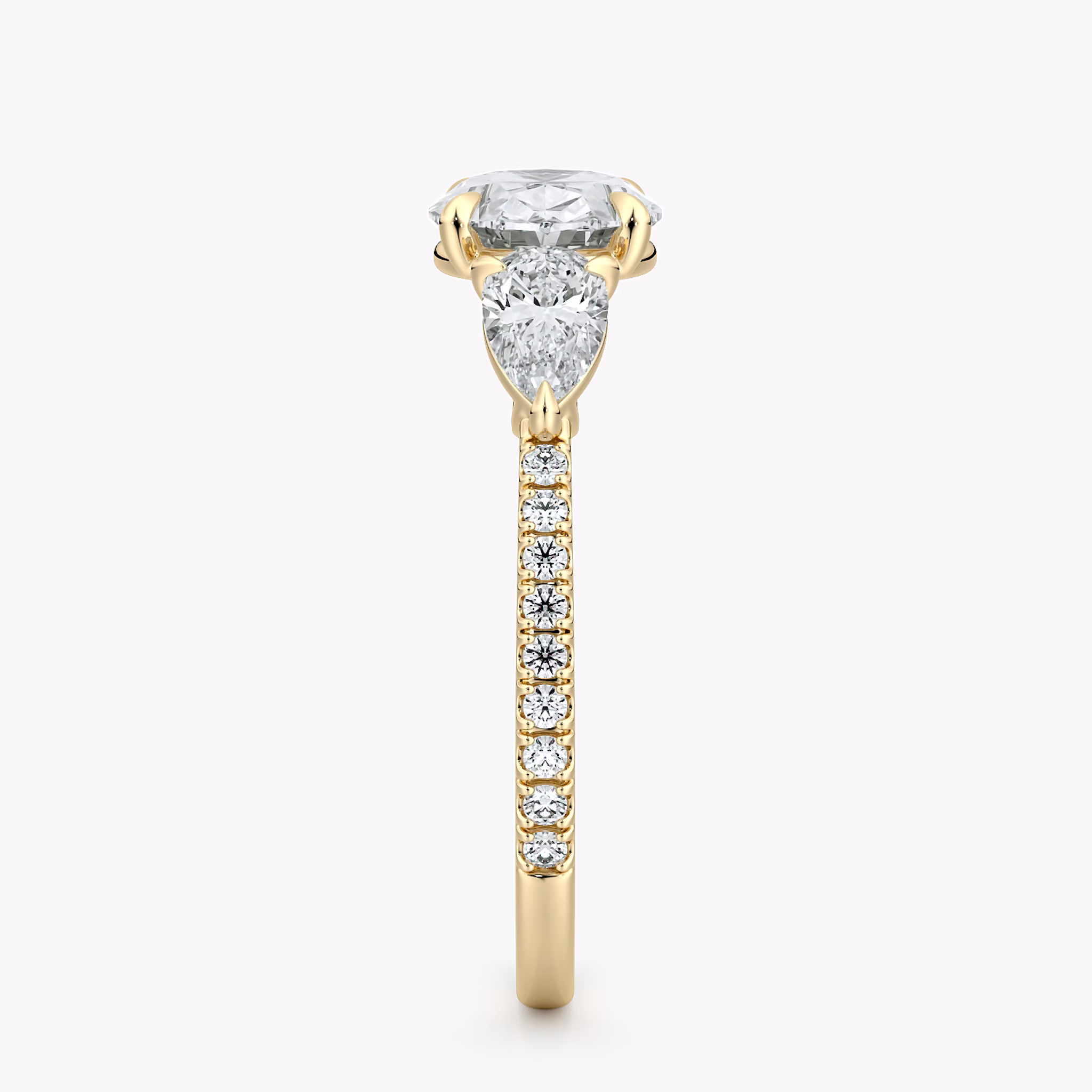 The Three Stone | Oval | 18k | Yellow Gold | bandAccent: Pavé | diamondOrientation: horizontal | sideStoneCarat: 0.25ct | sideStoneShape: Pear | caratWeight: other