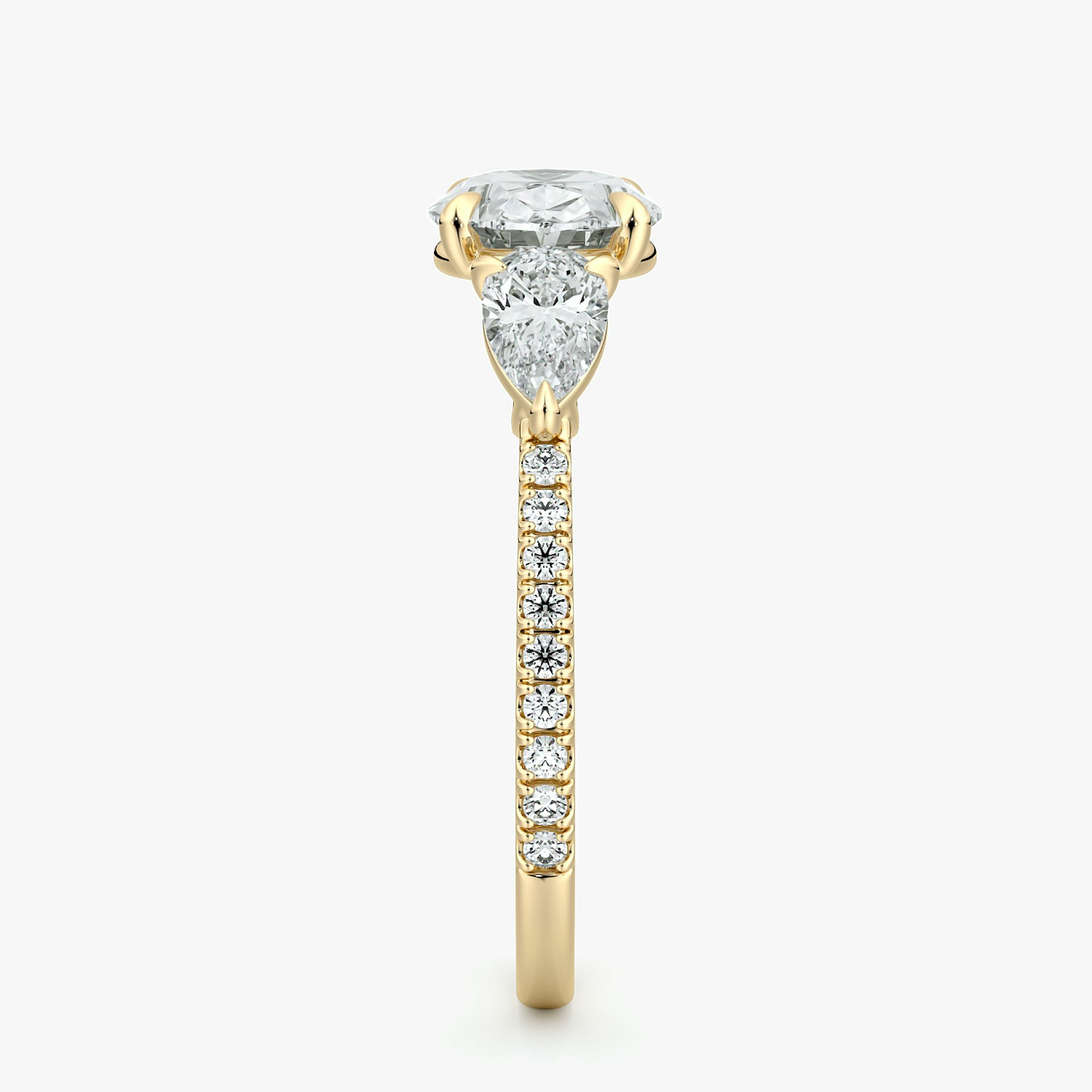 The Three Stone | Oval | 18k | Yellow Gold | bandAccent: Pavé | diamondOrientation: horizontal | sideStoneCarat: 0.25ct | sideStoneShape: Pear | caratWeight: other