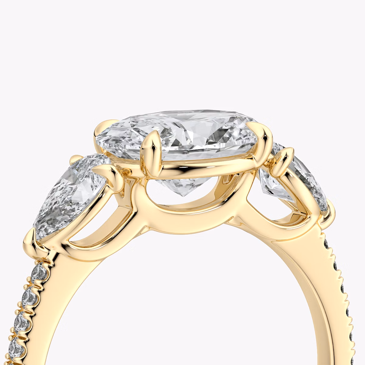 The Three Stone | Oval | 18k | Yellow Gold | bandAccent: Pavé | diamondOrientation: horizontal | sideStoneCarat: 0.25ct | sideStoneShape: Pear | caratWeight: other