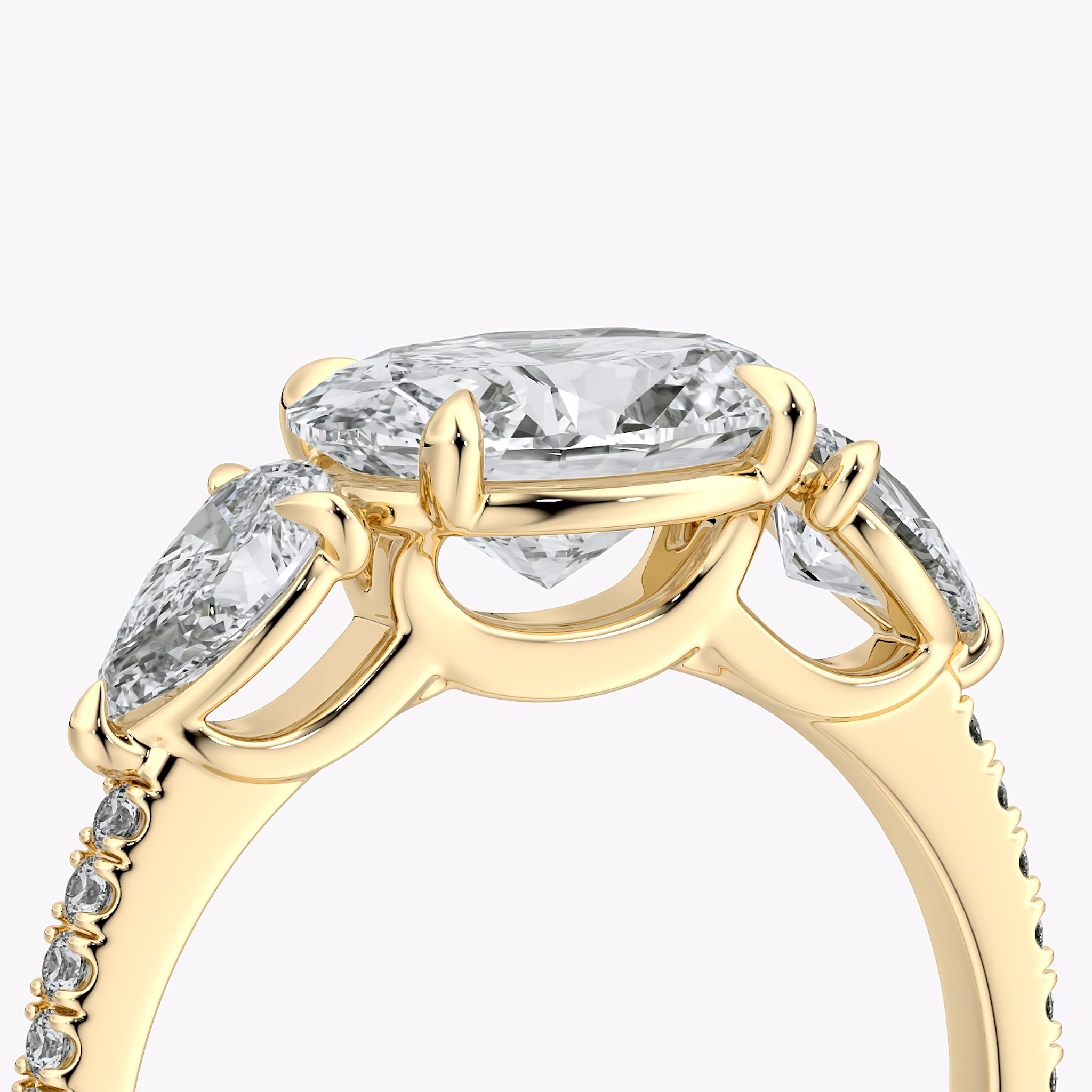 The Three Stone | Oval | 18k | Yellow Gold | bandAccent: Pavé | diamondOrientation: horizontal | sideStoneCarat: 0.25ct | sideStoneShape: Pear | caratWeight: other