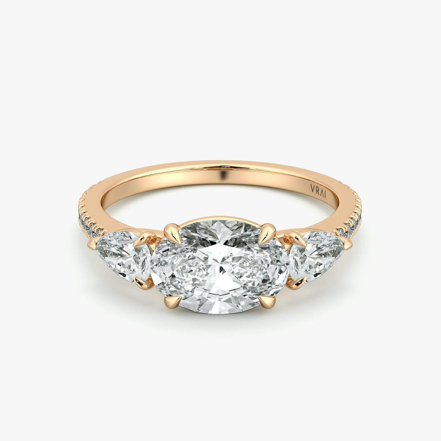 The Three Stone | Oval | 14k | Rose Gold | bandAccent: Pavé | diamondOrientation: horizontal | sideStoneCarat: 0.25ct | sideStoneShape: Pear | caratWeight: other