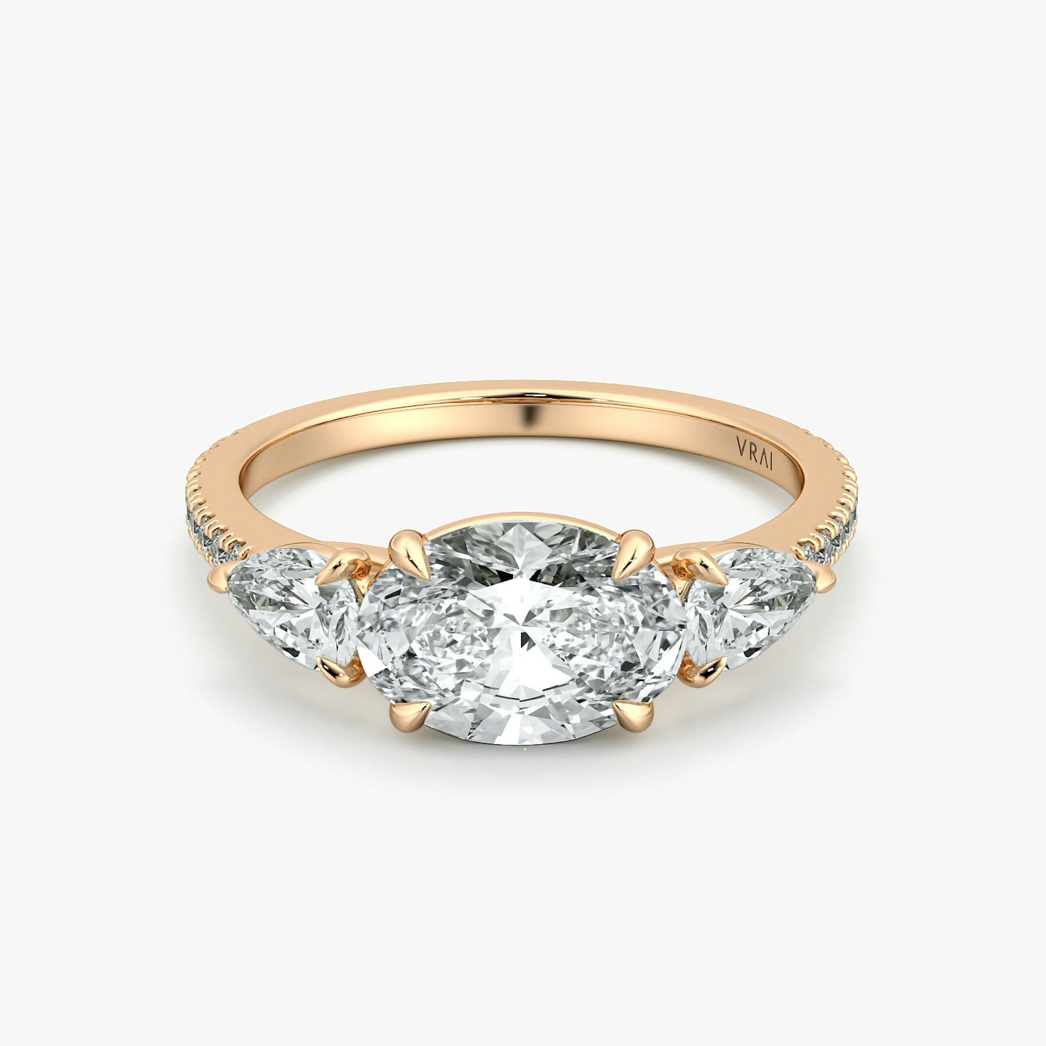 The Three Stone | Oval | 14k | Rose Gold | bandAccent: Pavé | diamondOrientation: horizontal | sideStoneCarat: 0.25ct | sideStoneShape: Pear | caratWeight: other