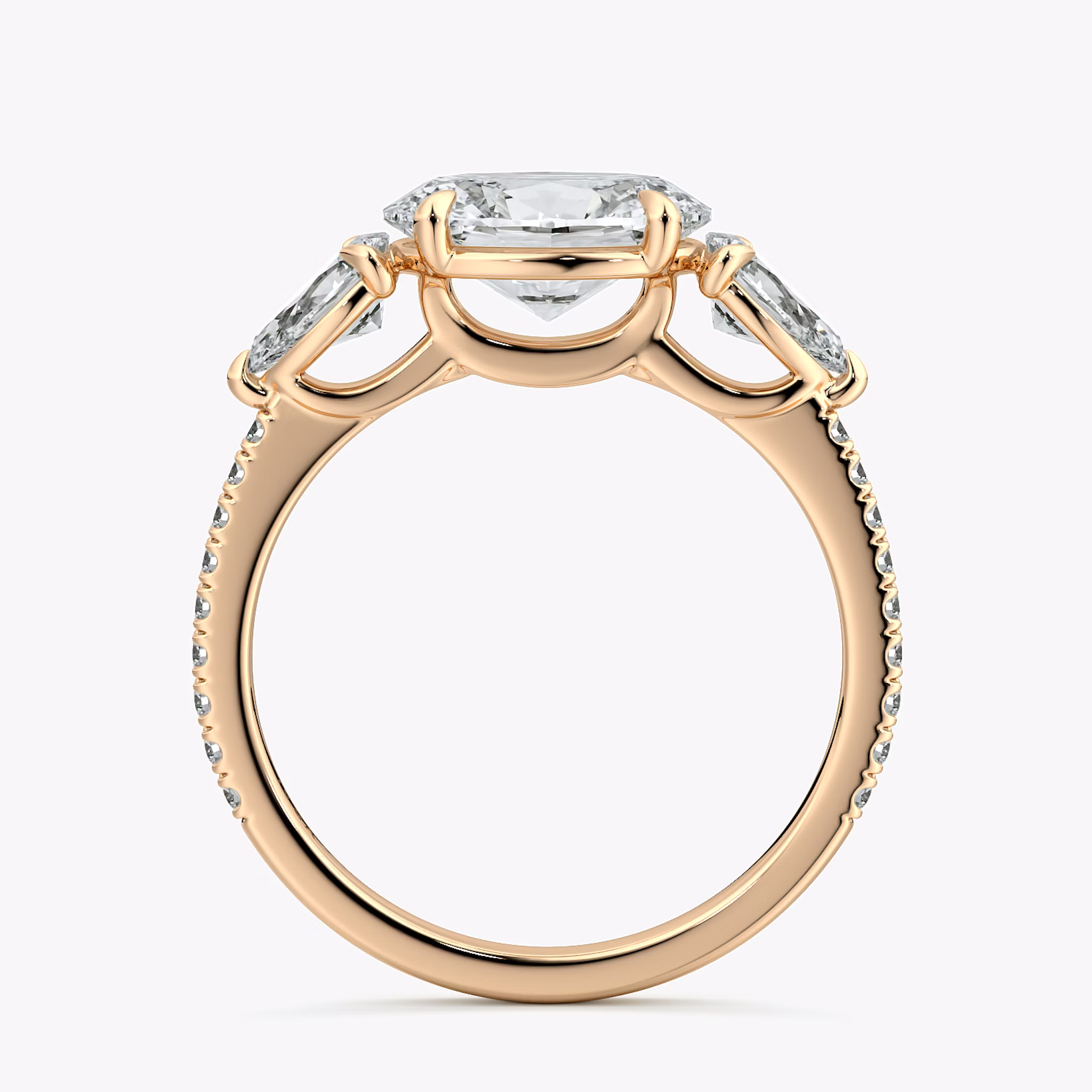 The Three Stone | Oval | 14k | Rose Gold | bandAccent: Pavé | diamondOrientation: horizontal | sideStoneCarat: 0.25ct | sideStoneShape: Pear | caratWeight: other