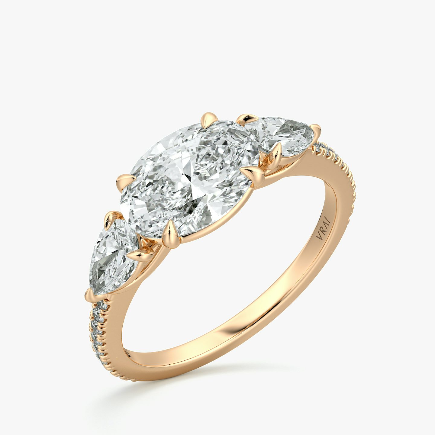 The Three Stone | Oval | 14k | Rose Gold | bandAccent: Pavé | diamondOrientation: horizontal | sideStoneCarat: 0.25ct | sideStoneShape: Pear | caratWeight: other