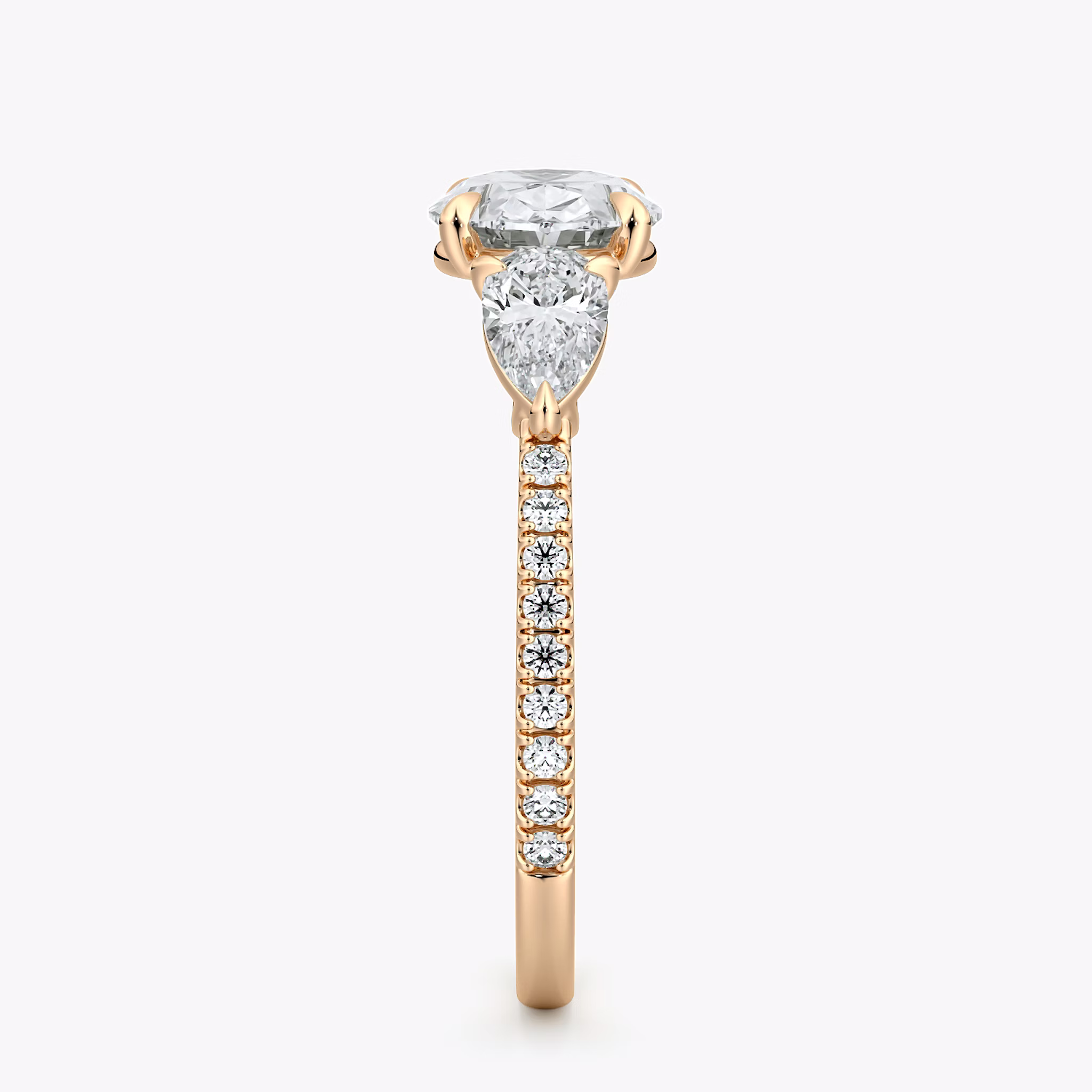 The Three Stone | Oval | 14k | Rose Gold | bandAccent: Pavé | diamondOrientation: horizontal | sideStoneCarat: 0.25ct | sideStoneShape: Pear | caratWeight: other