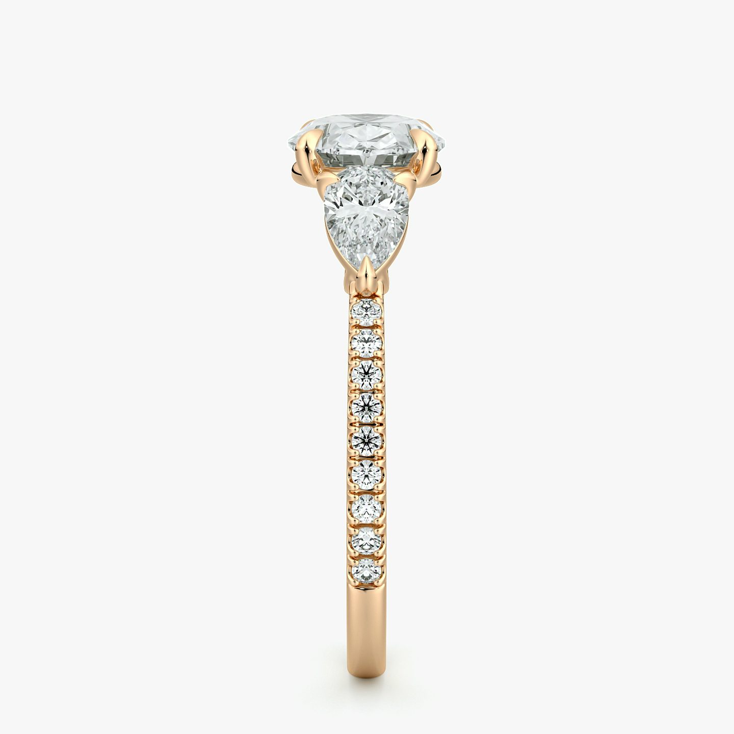 The Three Stone | Oval | 14k | Rose Gold | bandAccent: Pavé | diamondOrientation: horizontal | sideStoneCarat: 0.25ct | sideStoneShape: Pear | caratWeight: other