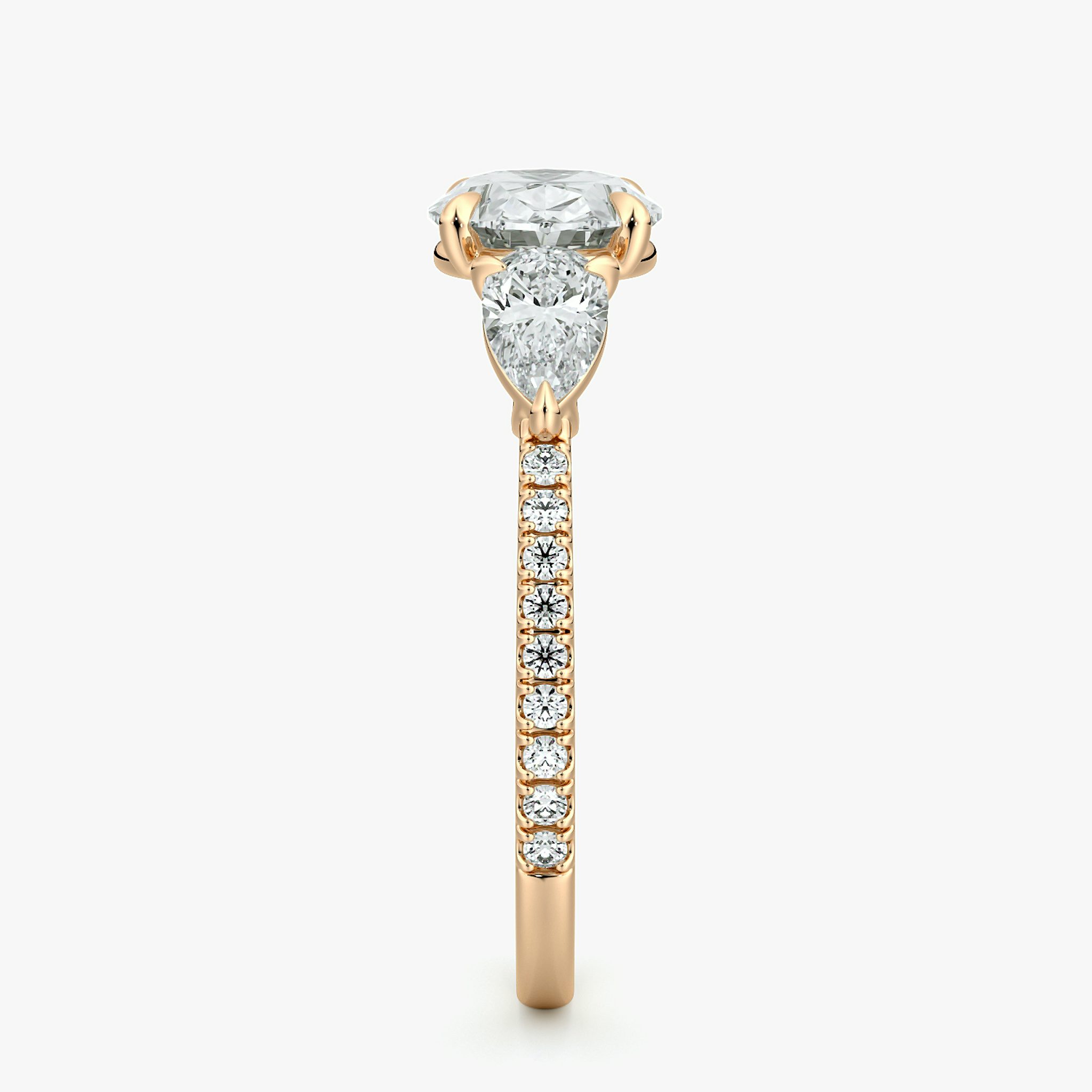 The Three Stone | Oval | 14k | Rose Gold | bandAccent: Pavé | diamondOrientation: horizontal | sideStoneCarat: 0.25ct | sideStoneShape: Pear | caratWeight: other