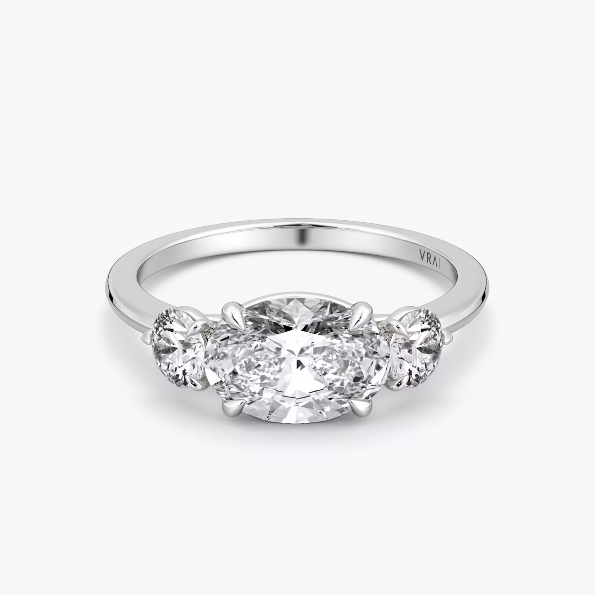 The Three Stone | Oval | Platinum | bandAccent: Plain | diamondOrientation: horizontal | sideStoneCarat: 0.25ct | sideStoneShape: Round Brilliant | caratWeight: other