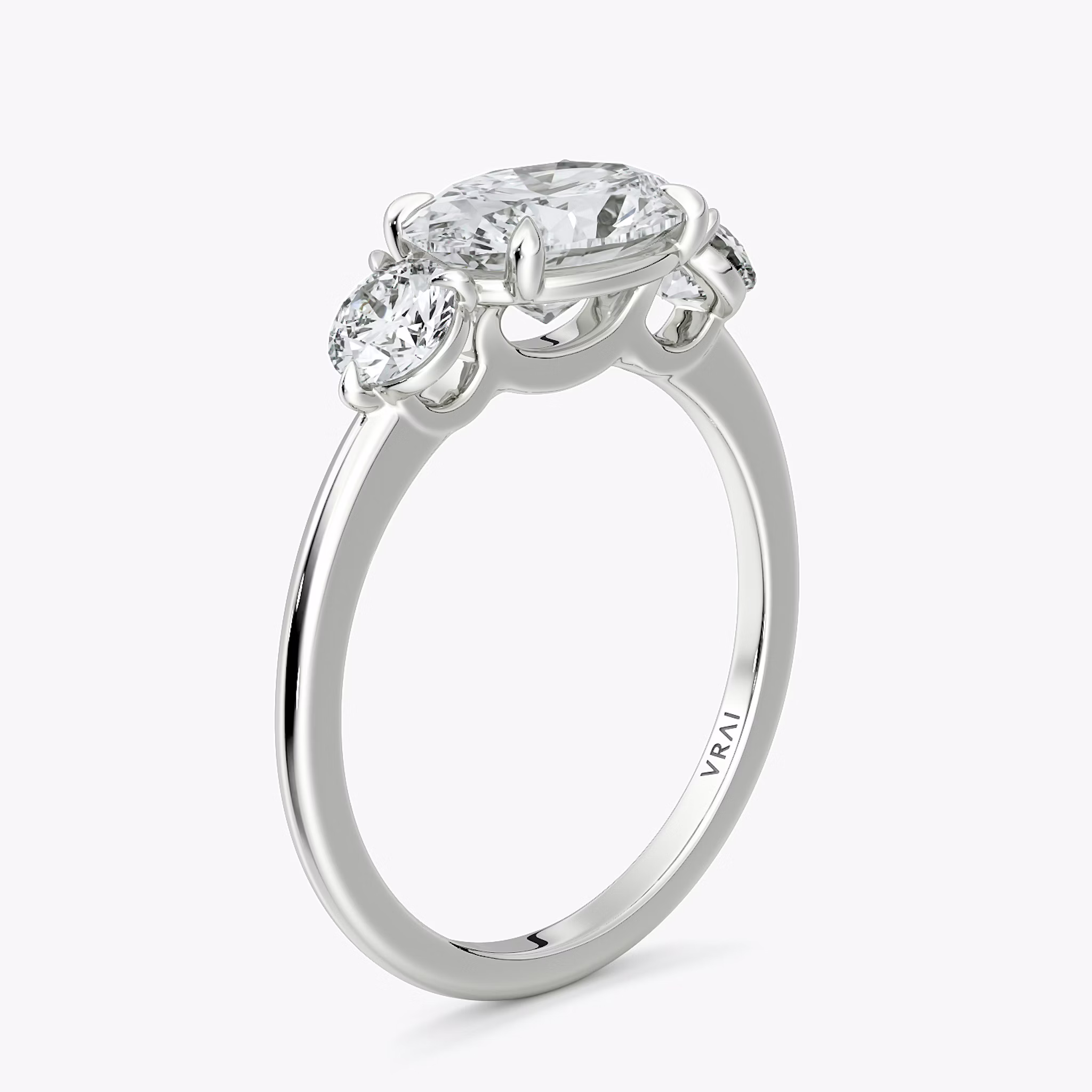The Three Stone | Oval | 18k | White Gold | bandAccent: Plain | diamondOrientation: horizontal | sideStoneCarat: 0.25ct | sideStoneShape: Round Brilliant | caratWeight: other