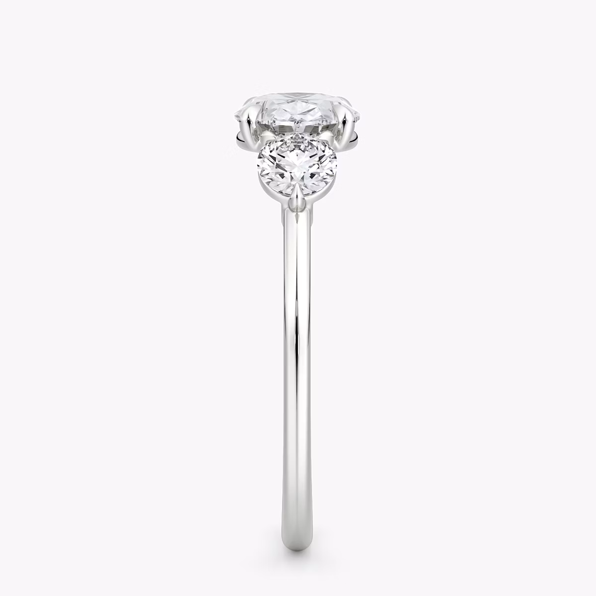 The Three Stone | Oval | Platinum | bandAccent: Plain | diamondOrientation: horizontal | sideStoneCarat: 0.25ct | sideStoneShape: Round Brilliant | caratWeight: other
