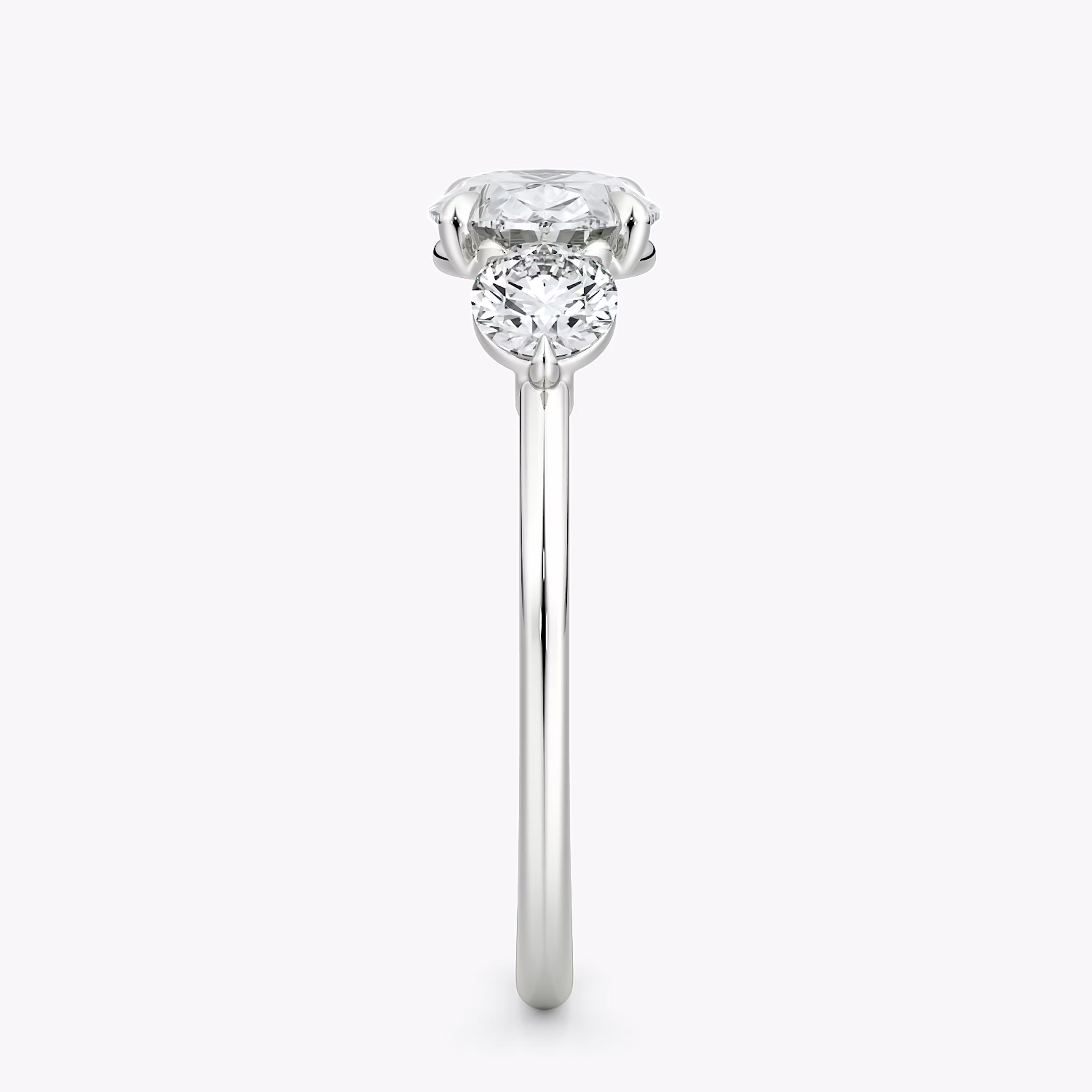 The Three Stone | Oval | 18k | White Gold | bandAccent: Plain | diamondOrientation: horizontal | sideStoneCarat: 0.25ct | sideStoneShape: Round Brilliant | caratWeight: other