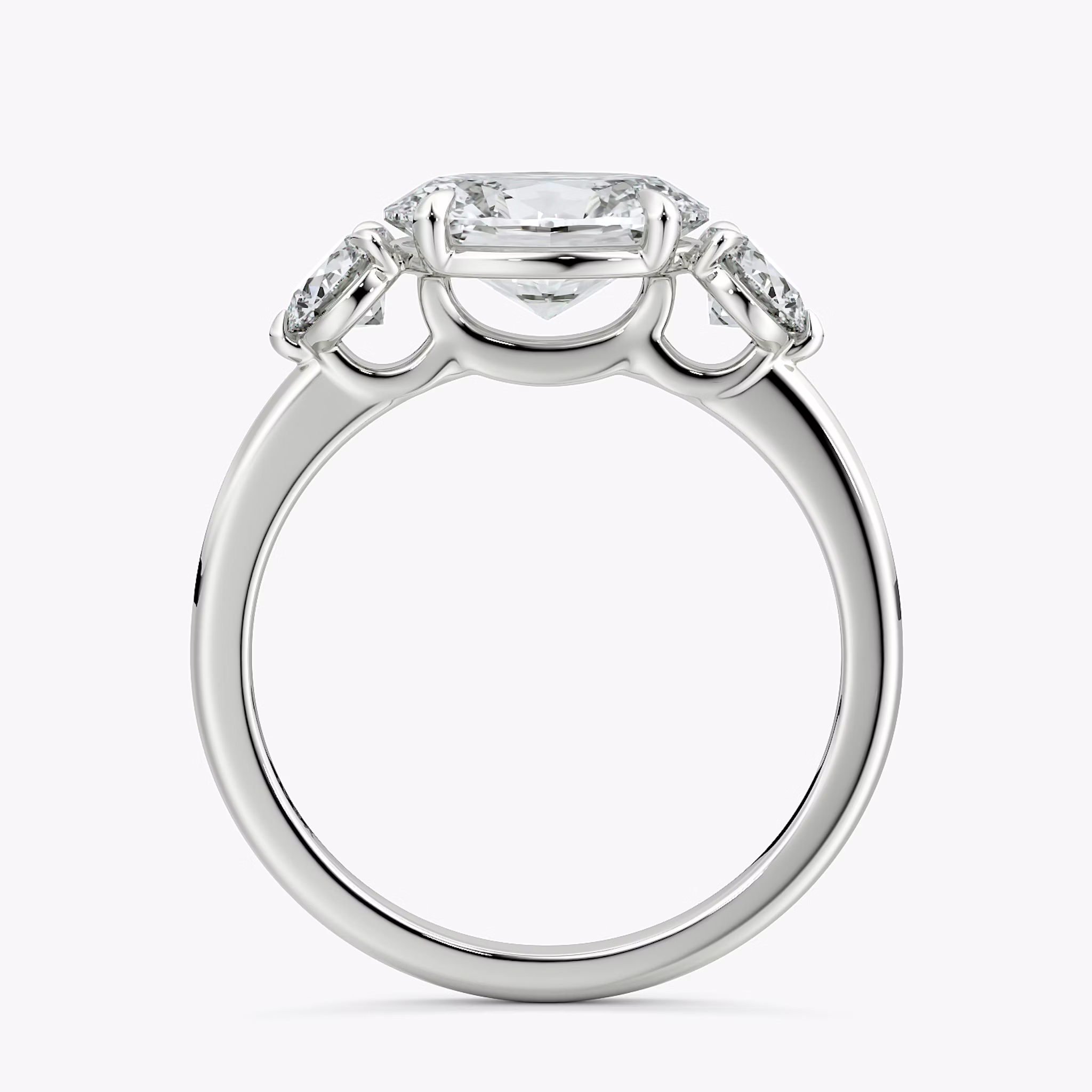 The Three Stone | Oval | 18k | White Gold | bandAccent: Plain | diamondOrientation: horizontal | sideStoneCarat: 0.25ct | sideStoneShape: Round Brilliant | caratWeight: other