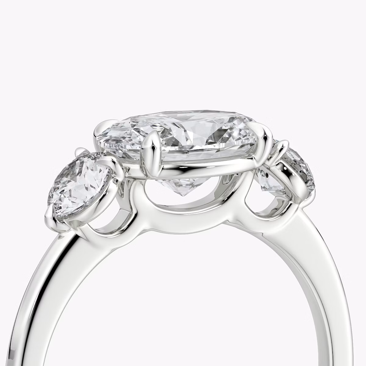 The Three Stone | Oval | Platinum | bandAccent: Plain | diamondOrientation: horizontal | sideStoneCarat: 0.25ct | sideStoneShape: Round Brilliant | caratWeight: other