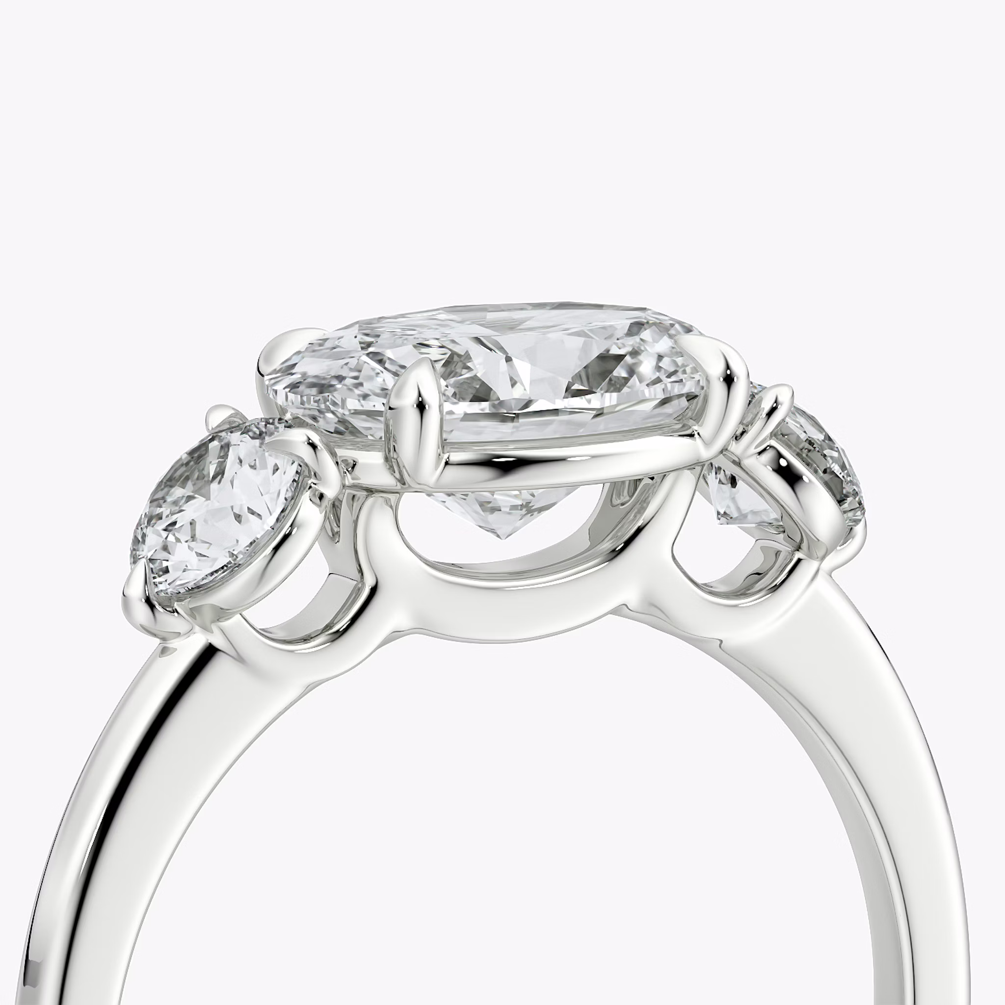 The Three Stone | Oval | 18k | White Gold | bandAccent: Plain | diamondOrientation: horizontal | sideStoneCarat: 0.25ct | sideStoneShape: Round Brilliant | caratWeight: other
