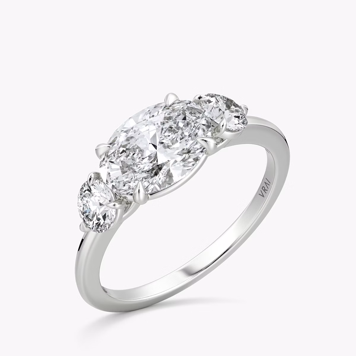 The Three Stone | Oval | Platinum | bandAccent: Plain | diamondOrientation: horizontal | sideStoneCarat: 0.25ct | sideStoneShape: Round Brilliant | caratWeight: other