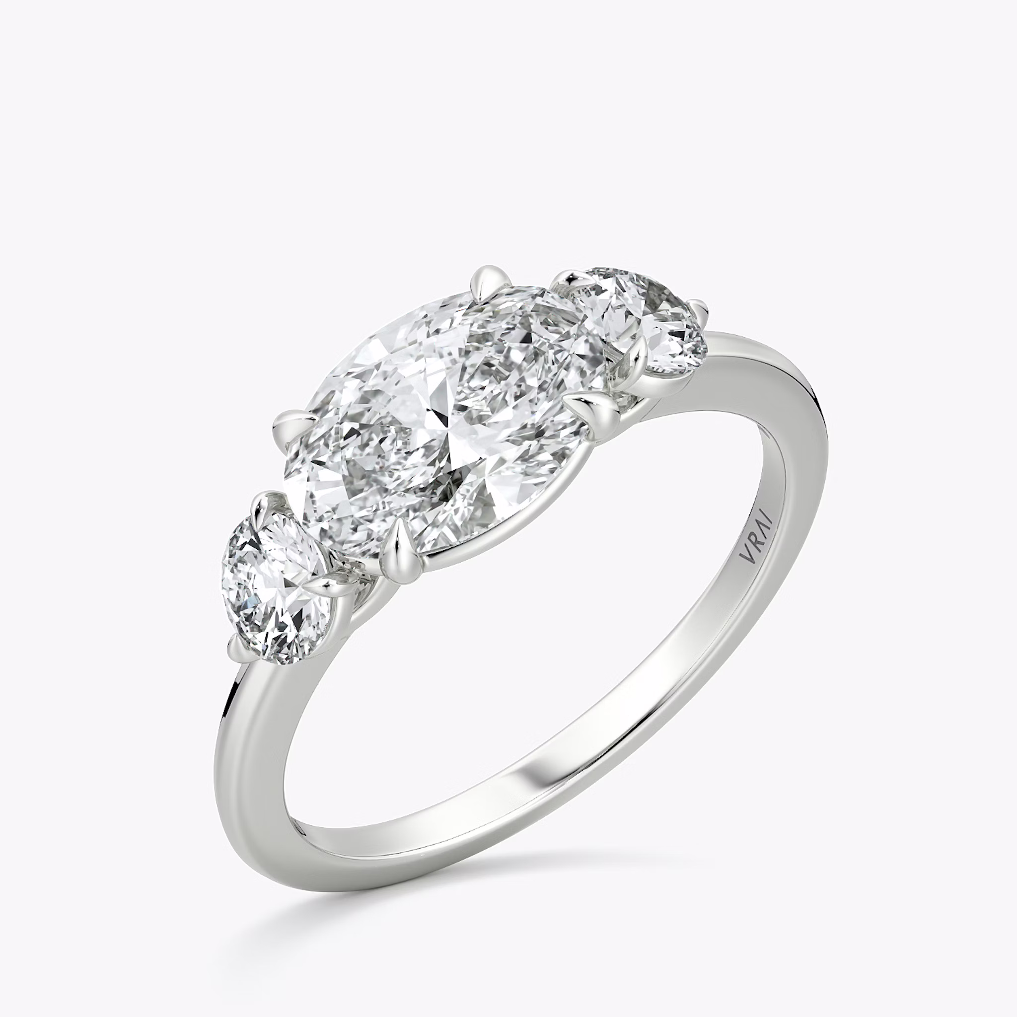 The Three Stone | Oval | 18k | White Gold | bandAccent: Plain | diamondOrientation: horizontal | sideStoneCarat: 0.25ct | sideStoneShape: Round Brilliant | caratWeight: other