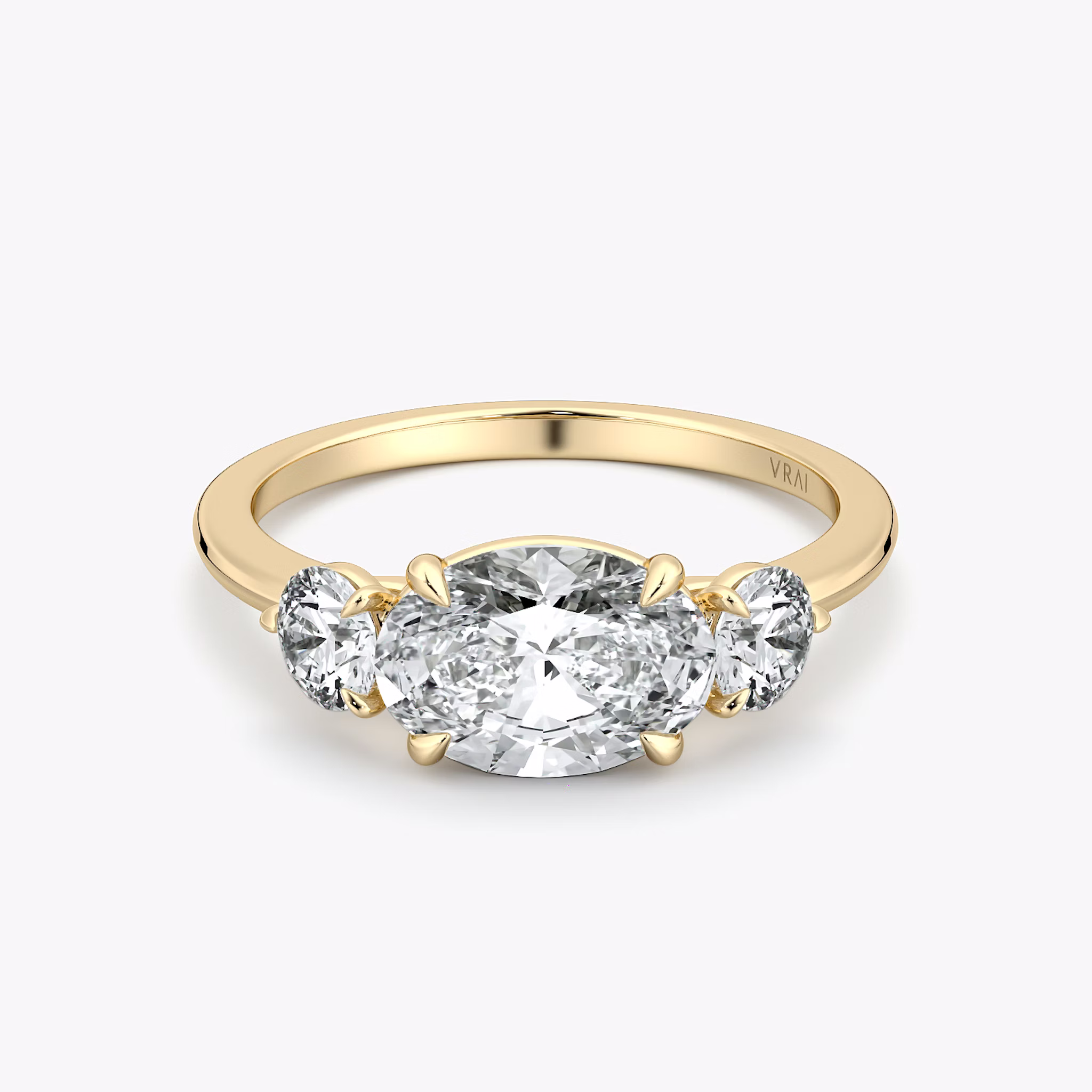 The Three Stone | Oval | 18k | Yellow Gold | bandAccent: Plain | diamondOrientation: horizontal | sideStoneCarat: 0.25ct | sideStoneShape: Round Brilliant | caratWeight: other