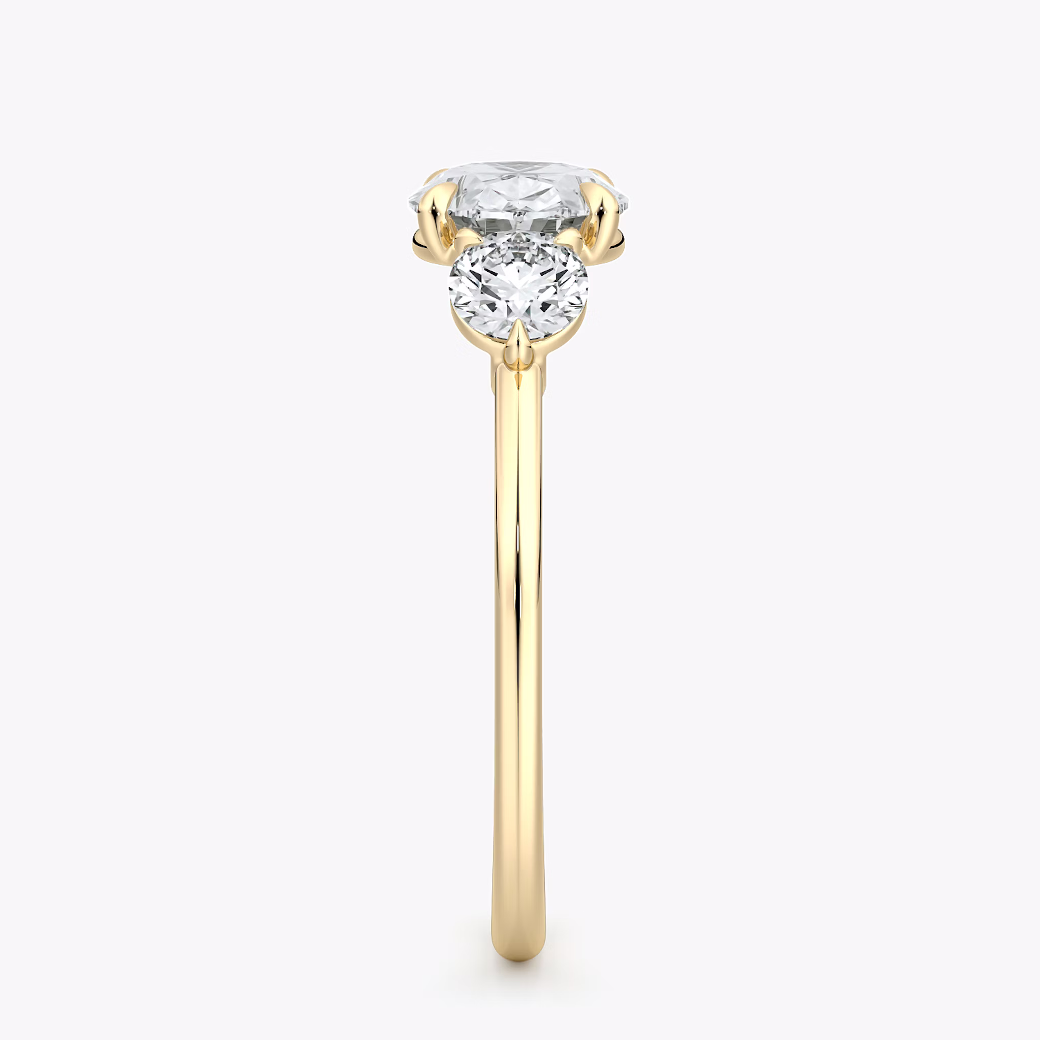 The Three Stone | Oval | 18k | Yellow Gold | bandAccent: Plain | diamondOrientation: horizontal | sideStoneCarat: 0.25ct | sideStoneShape: Round Brilliant | caratWeight: other