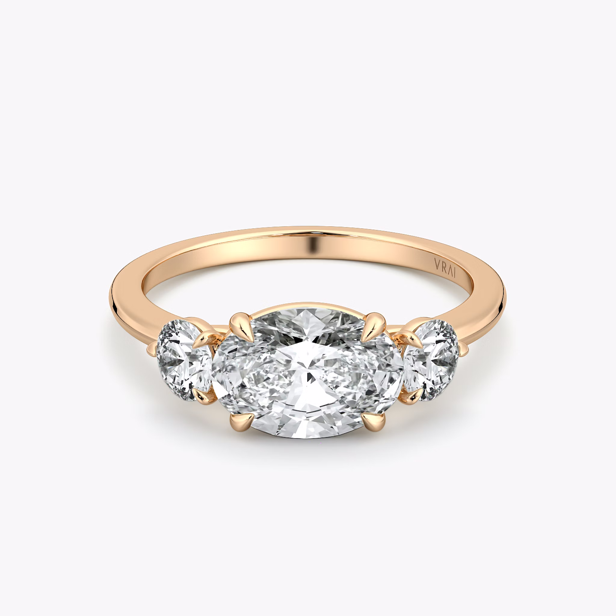 The Three Stone | Oval | 14k | Rose Gold | bandAccent: Plain | diamondOrientation: horizontal | sideStoneCarat: 0.25ct | sideStoneShape: Round Brilliant | caratWeight: other