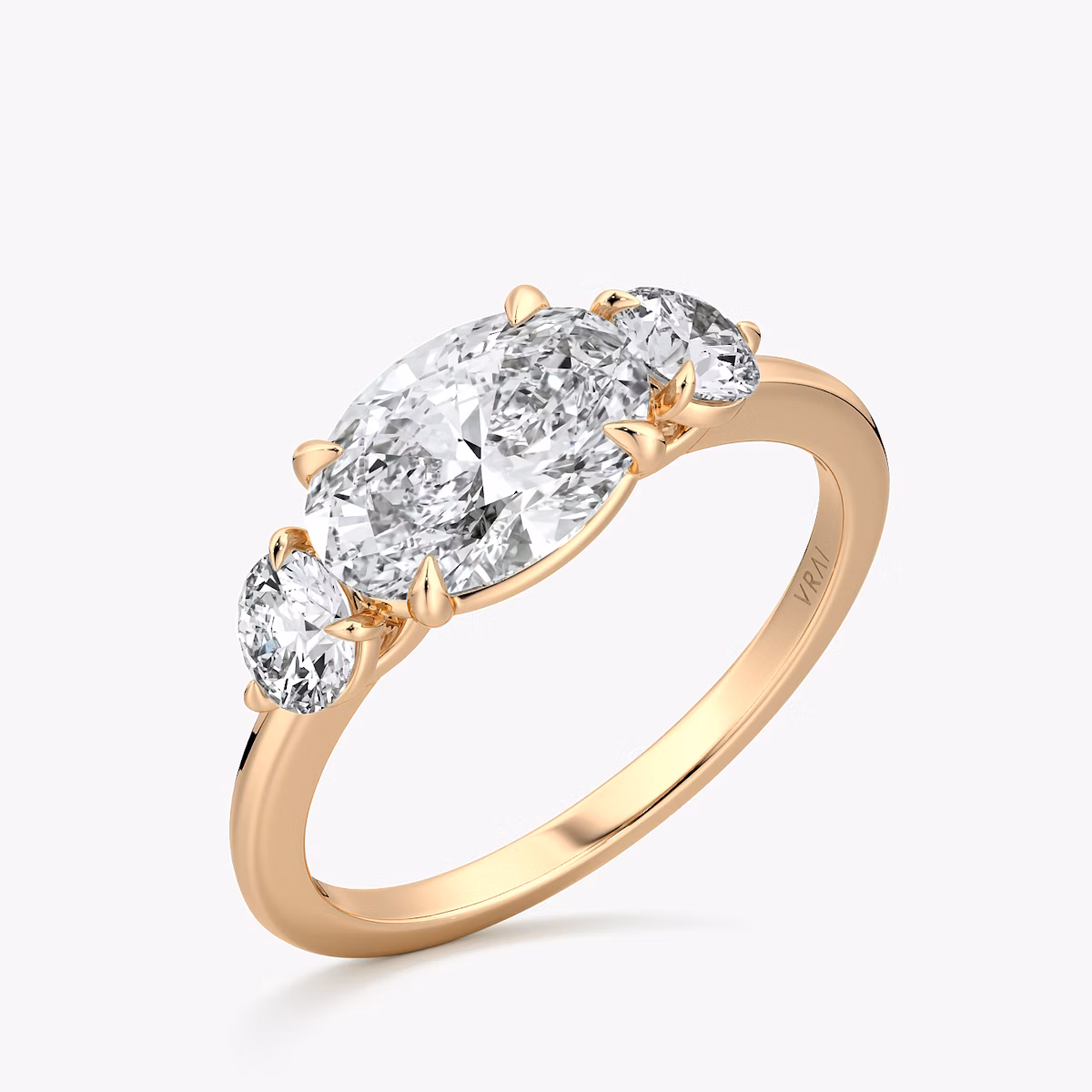 The Three Stone | Oval | 14k | Rose Gold | bandAccent: Plain | diamondOrientation: horizontal | sideStoneCarat: 0.25ct | sideStoneShape: Round Brilliant | caratWeight: other