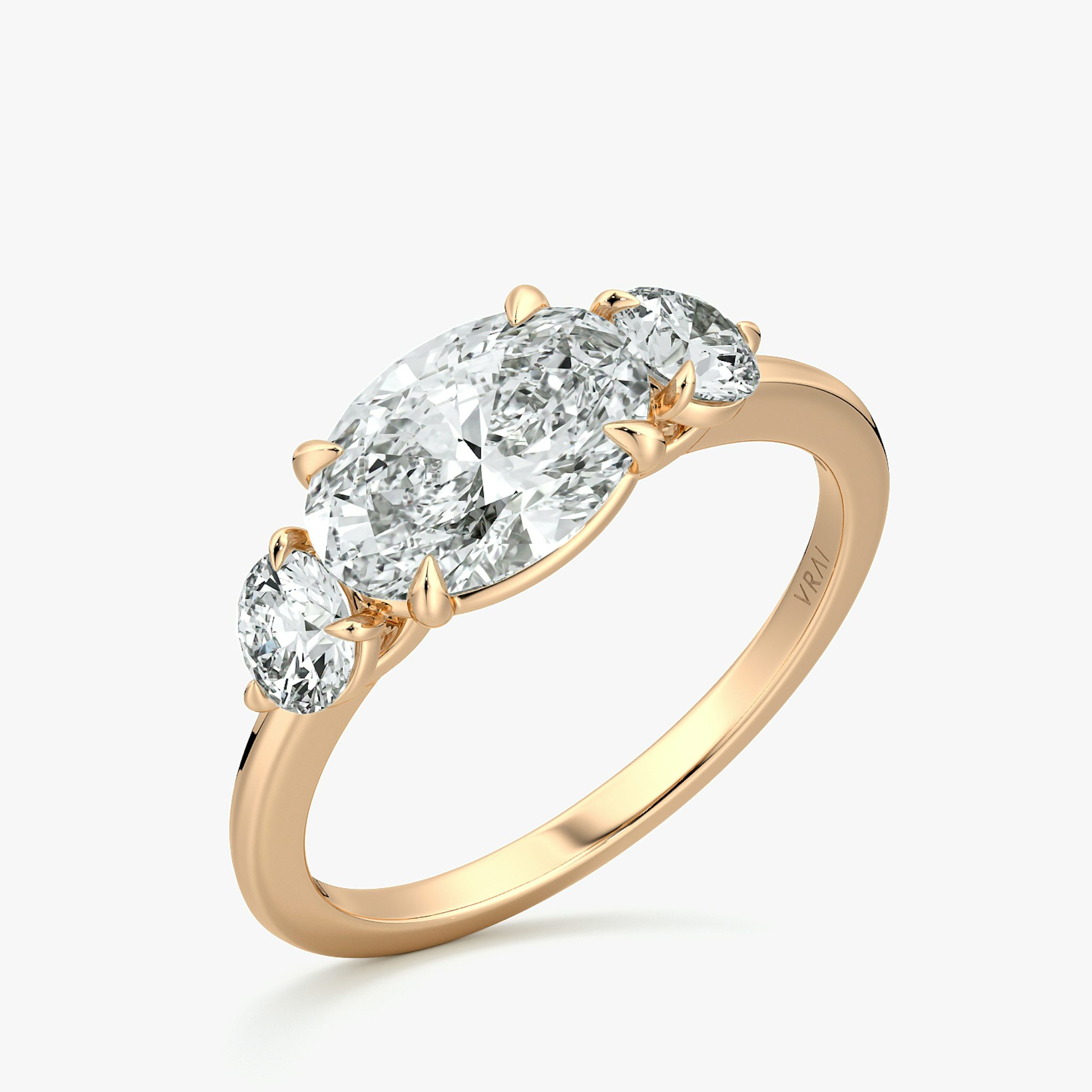 The Three Stone | Oval | 14k | Rose Gold | bandAccent: Plain | diamondOrientation: horizontal | sideStoneCarat: 0.25ct | sideStoneShape: Round Brilliant | caratWeight: other