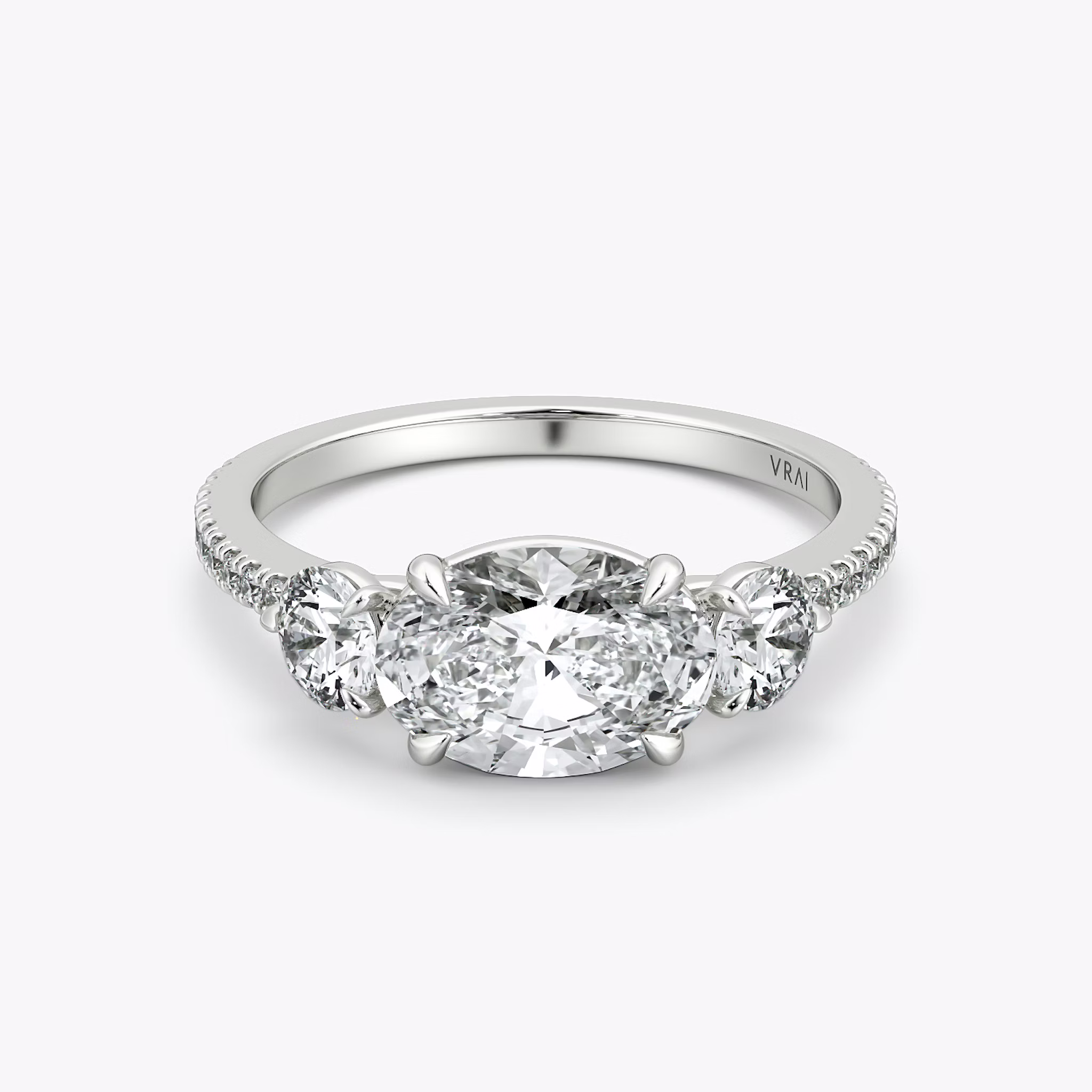 The Three Stone | Oval | 18k | White Gold | bandAccent: Pavé | diamondOrientation: horizontal | sideStoneCarat: 0.25ct | sideStoneShape: Round Brilliant | caratWeight: other