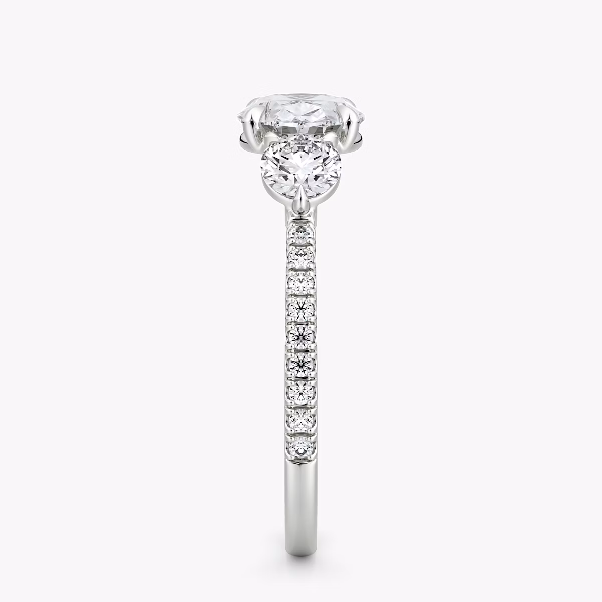 The Three Stone | Oval | 18k | White Gold | bandAccent: Pavé | diamondOrientation: horizontal | sideStoneCarat: 0.25ct | sideStoneShape: Round Brilliant | caratWeight: other