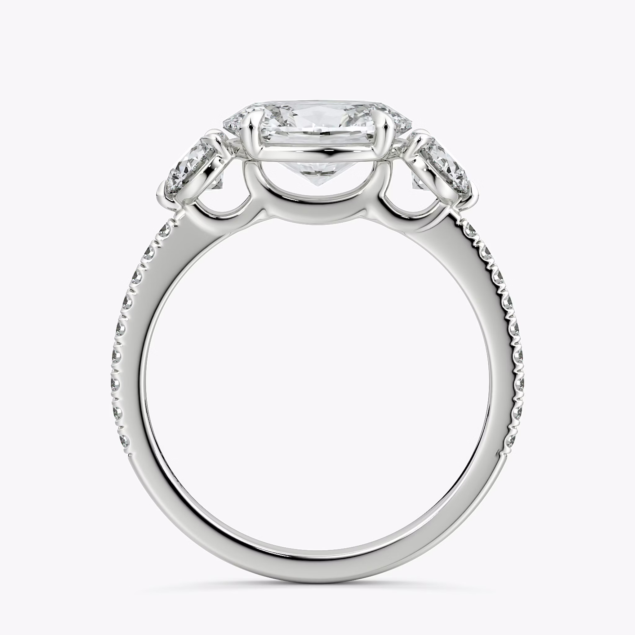 The Three Stone | Oval | 18k | White Gold | bandAccent: Pavé | diamondOrientation: horizontal | sideStoneCarat: 0.25ct | sideStoneShape: Round Brilliant | caratWeight: other
