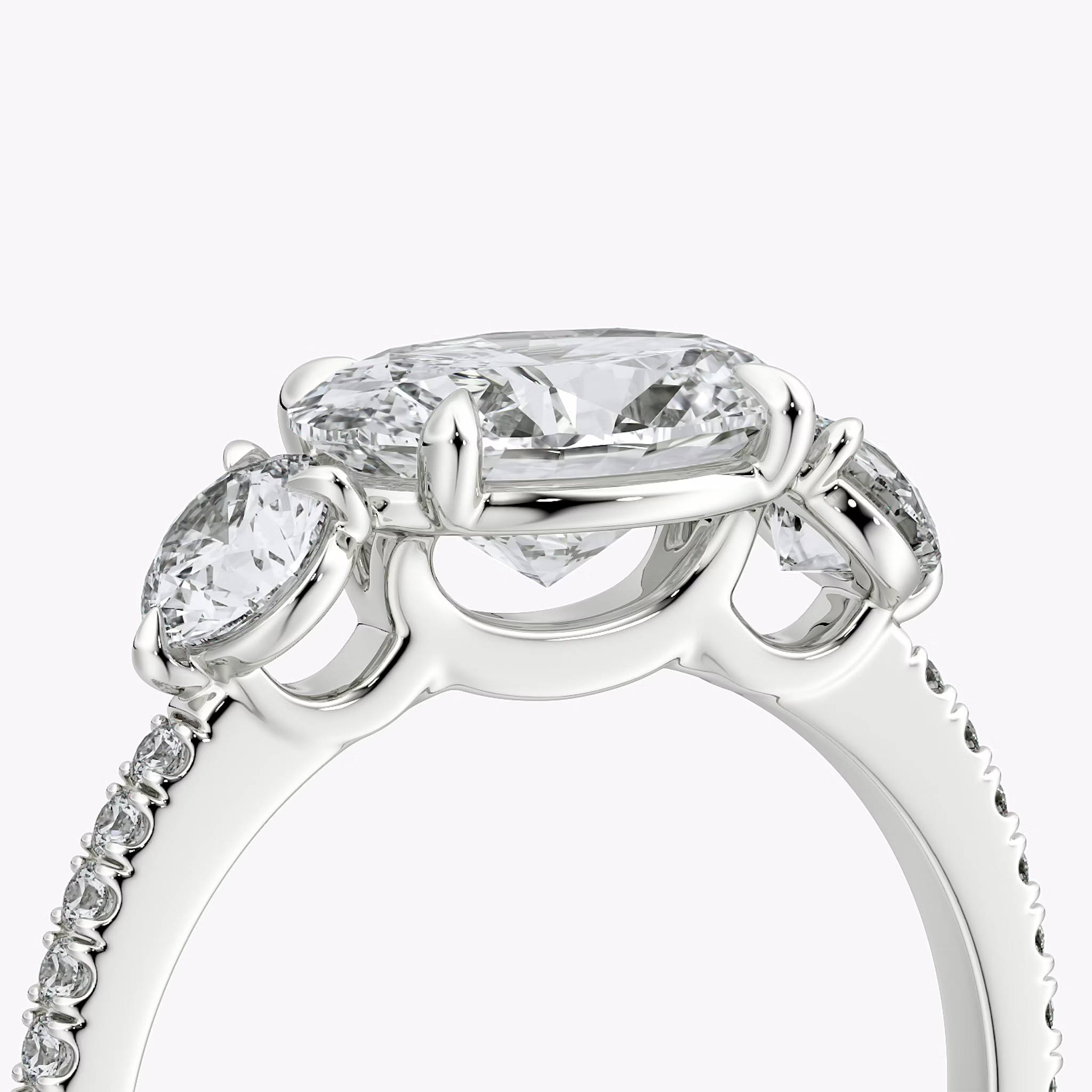 The Three Stone | Oval | 18k | White Gold | bandAccent: Pavé | diamondOrientation: horizontal | sideStoneCarat: 0.25ct | sideStoneShape: Round Brilliant | caratWeight: other