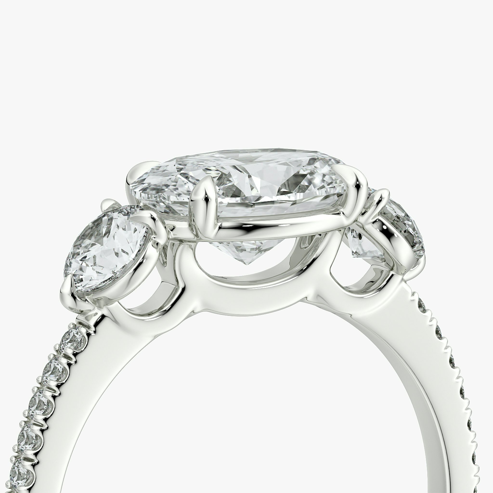 The Three Stone | Oval | 18k | White Gold | bandAccent: Pavé | diamondOrientation: horizontal | sideStoneCarat: 0.25ct | sideStoneShape: Round Brilliant | caratWeight: other