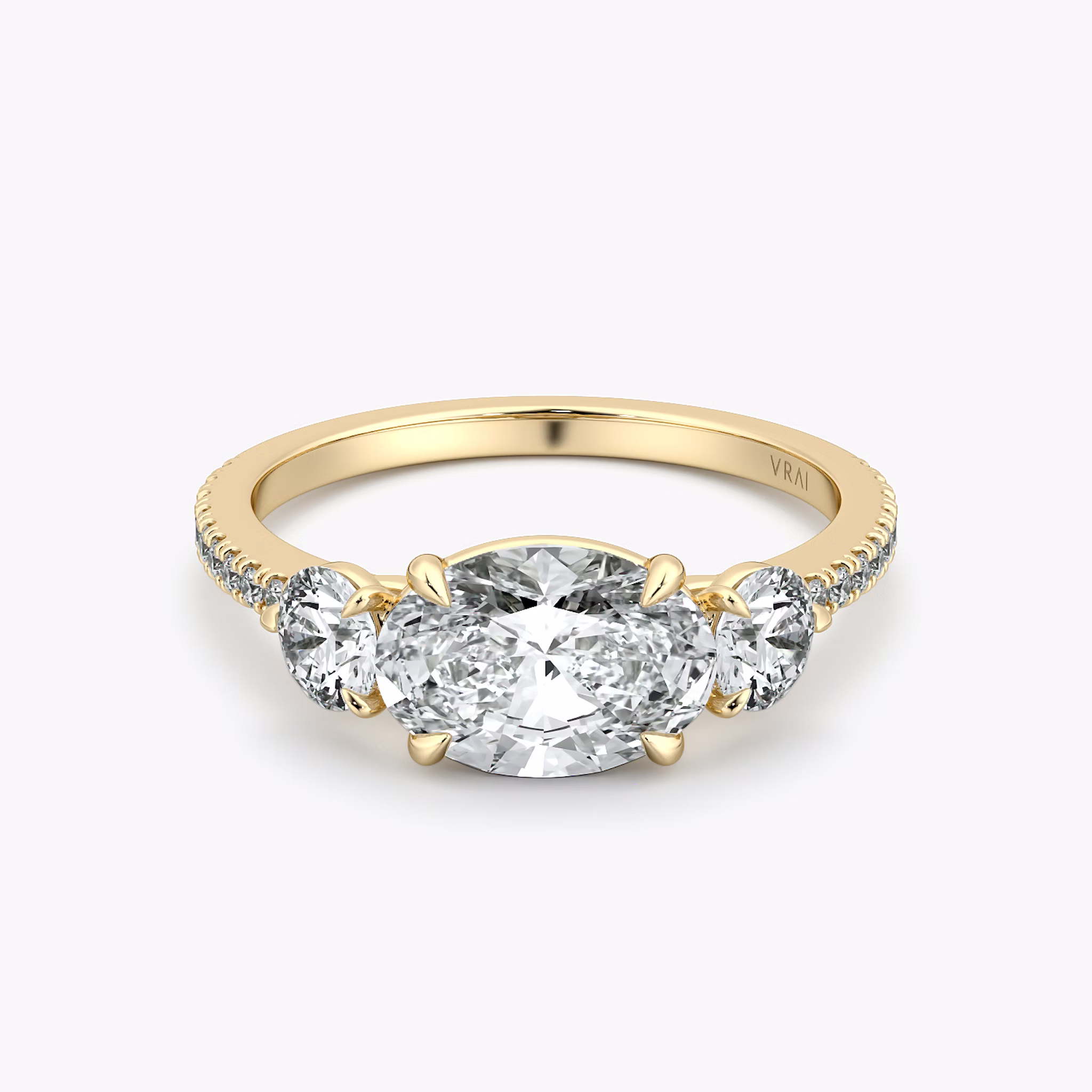 The Three Stone | Oval | 18k | Yellow Gold | bandAccent: Pavé | diamondOrientation: horizontal | sideStoneCarat: 0.25ct | sideStoneShape: Round Brilliant | caratWeight: other