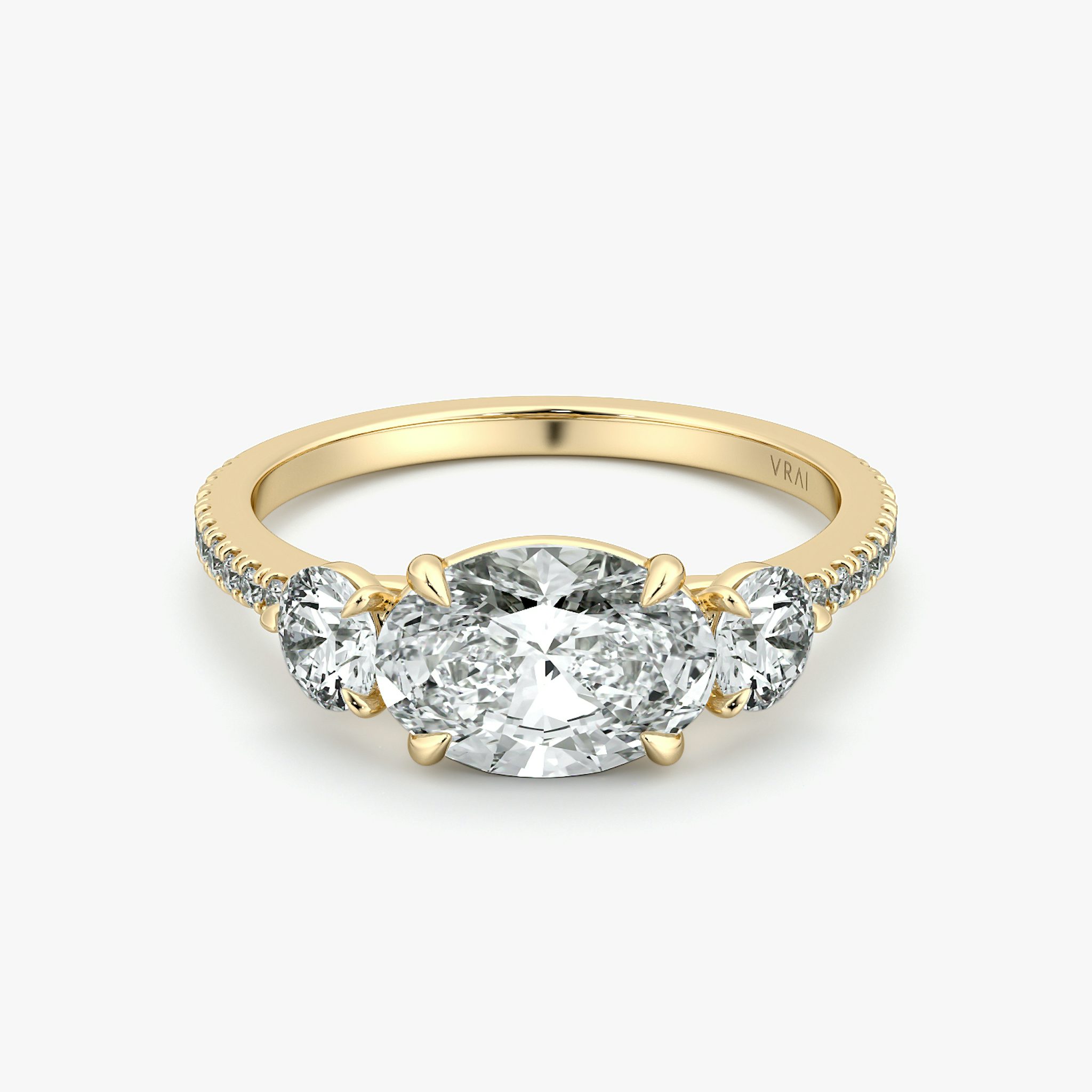 The Three Stone | Oval | 18k | Yellow Gold | bandAccent: Pavé | diamondOrientation: horizontal | sideStoneCarat: 0.25ct | sideStoneShape: Round Brilliant | caratWeight: other