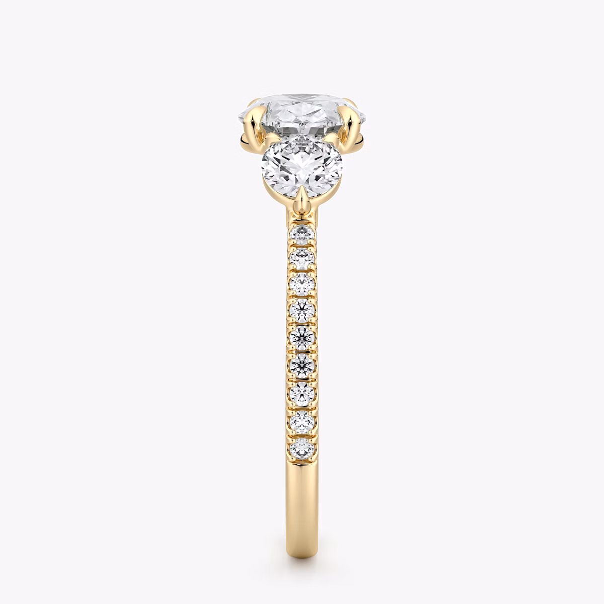 The Three Stone | Oval | 18k | Yellow Gold | bandAccent: Pavé | diamondOrientation: horizontal | sideStoneCarat: 0.25ct | sideStoneShape: Round Brilliant | caratWeight: other
