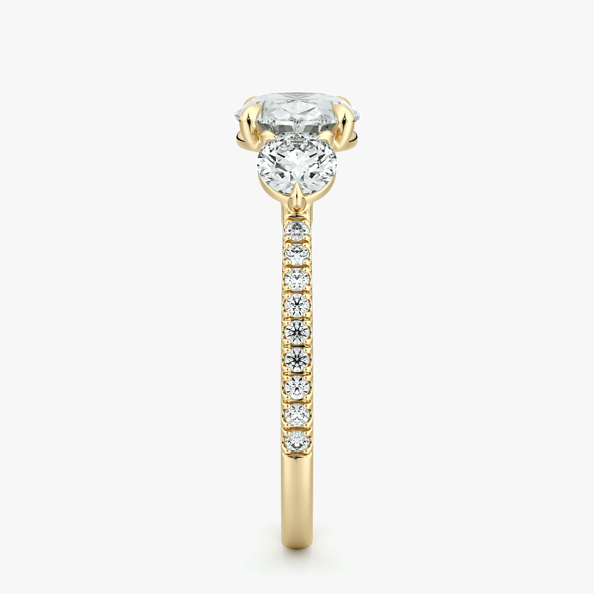 The Three Stone | Oval | 18k | Yellow Gold | bandAccent: Pavé | diamondOrientation: horizontal | sideStoneCarat: 0.25ct | sideStoneShape: Round Brilliant | caratWeight: other