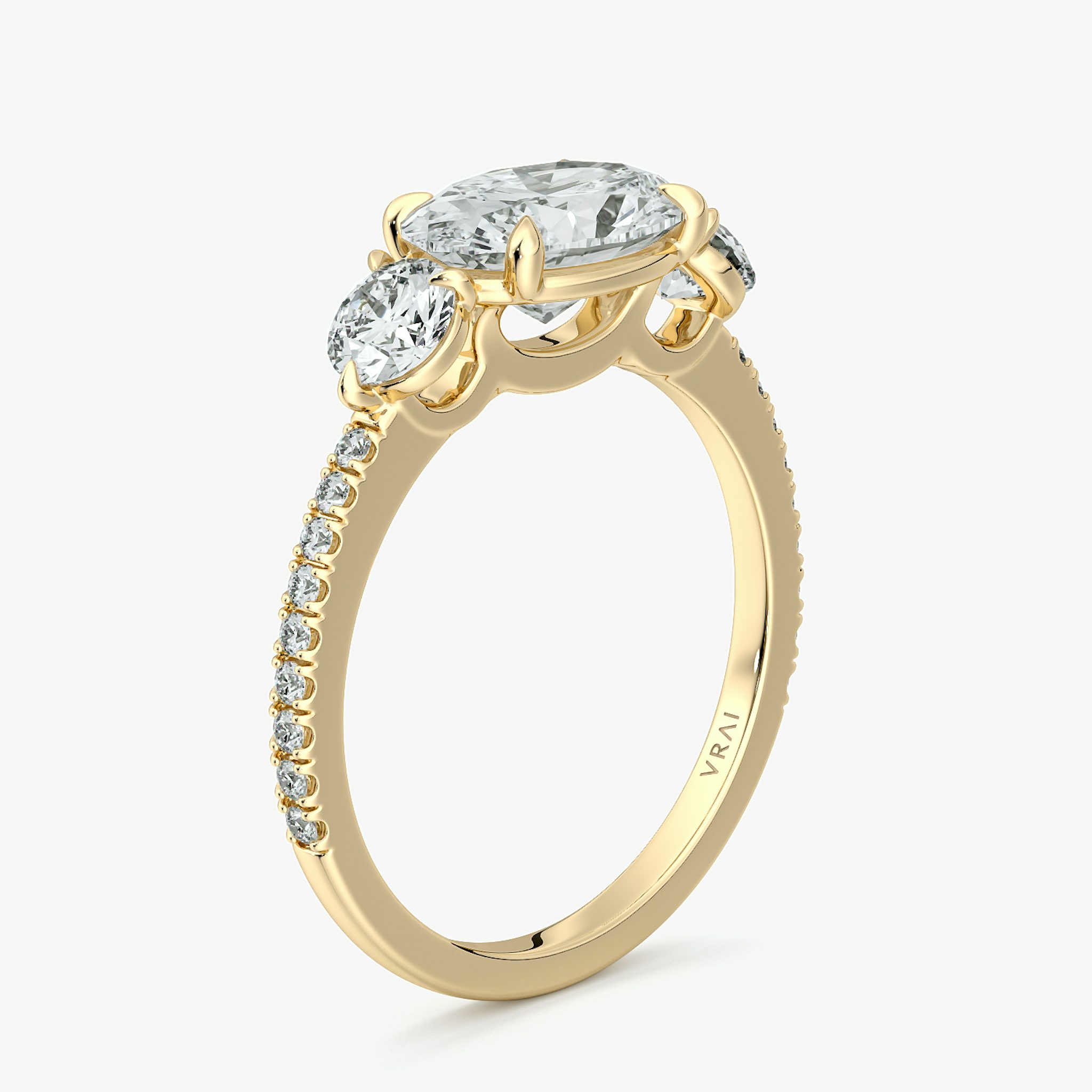 The Three Stone | Oval | 18k | Yellow Gold | bandAccent: Pavé | diamondOrientation: horizontal | sideStoneCarat: 0.25ct | sideStoneShape: Round Brilliant | caratWeight: other